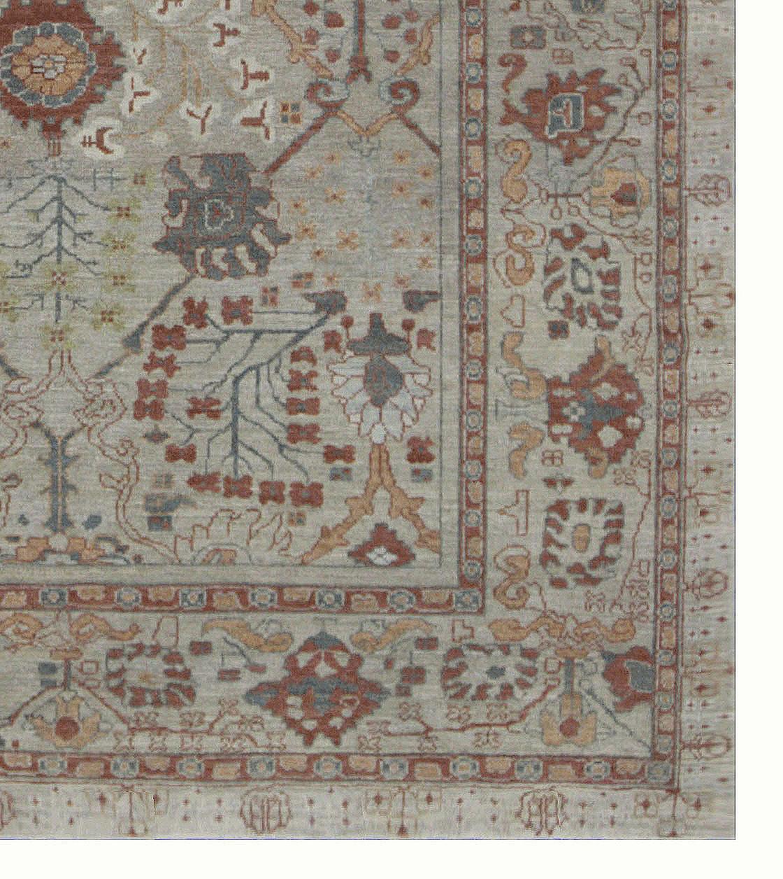 Modern Turkish rug made of handwoven sheep’s wool of the finest quality. It’s colored with organic vegetable dyes that are certified safe for humans and pets alike. It features a beautiful beige field with red and gray flower details closely
