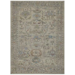 Modern Oushak Rug with Floral Motifs in Brown, Gray and Blue on Beige Field