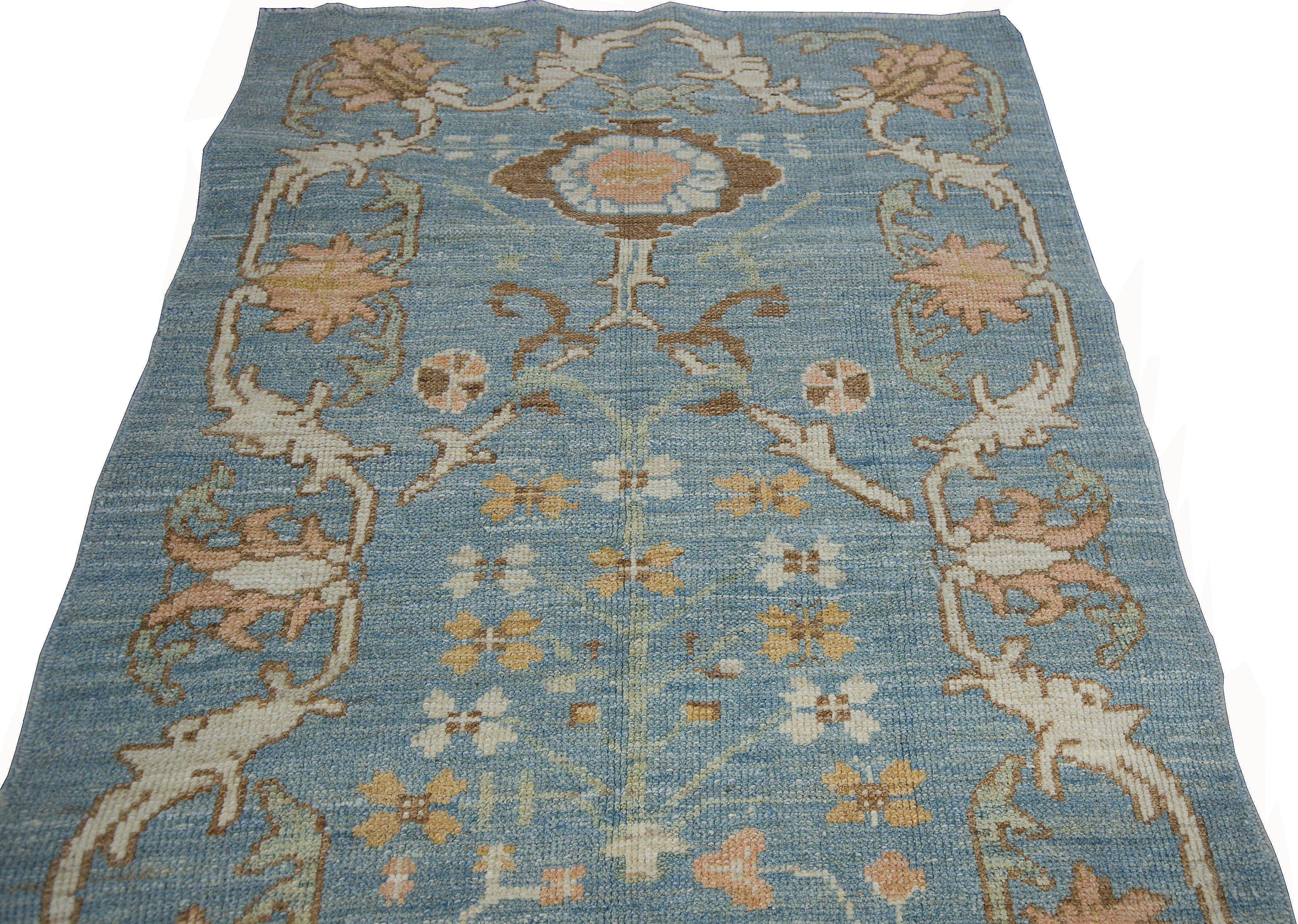 Turkish Modern Oushak Rug with Floral Motifs in Ivory, Brown and Orange on Blue Field For Sale