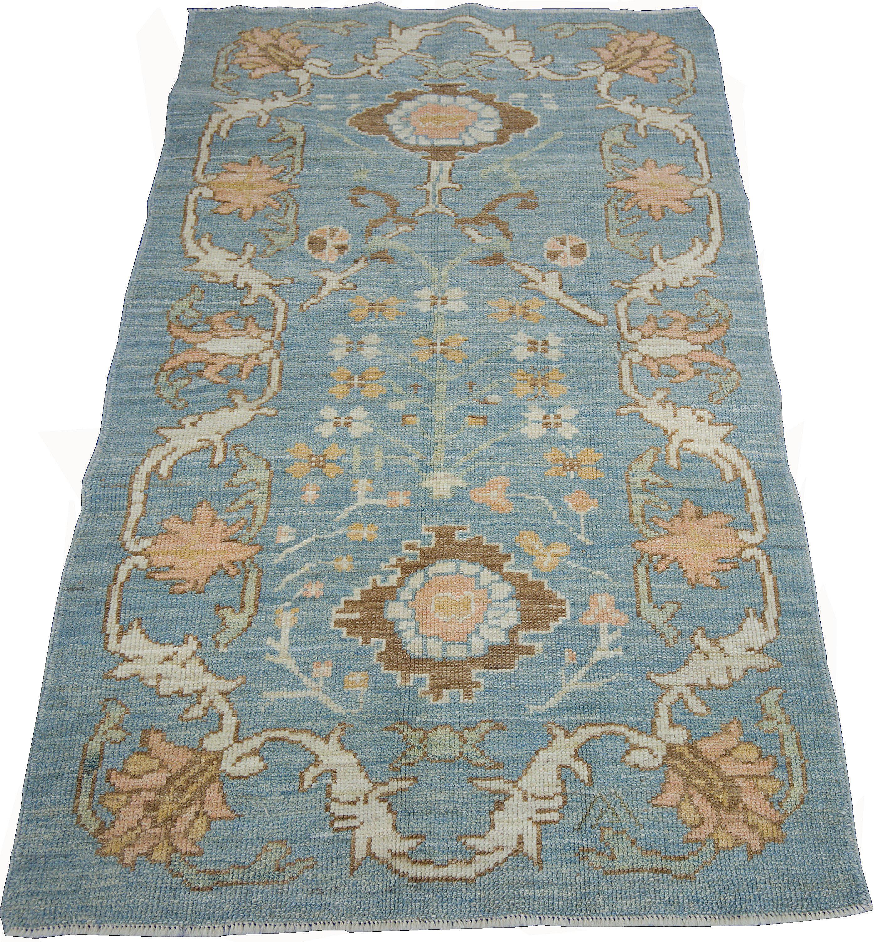 Hand-Woven Modern Oushak Rug with Floral Motifs in Ivory, Brown and Orange on Blue Field For Sale
