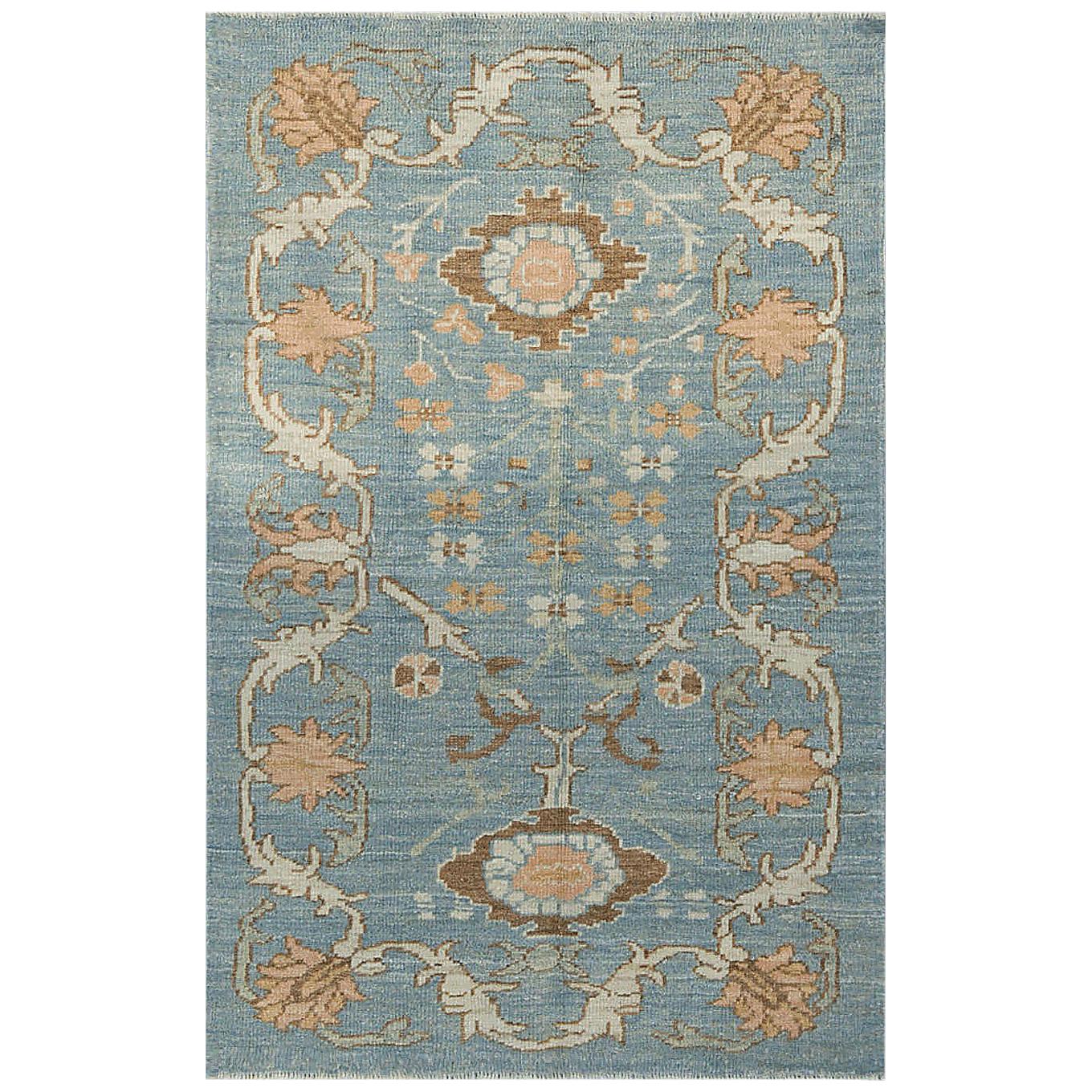 Modern Oushak Rug with Floral Motifs in Ivory, Brown and Orange on Blue Field For Sale