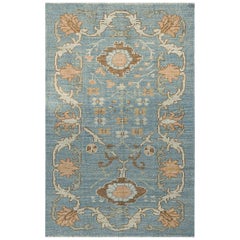 Modern Oushak Rug with Floral Motifs in Ivory, Brown and Orange on Blue Field