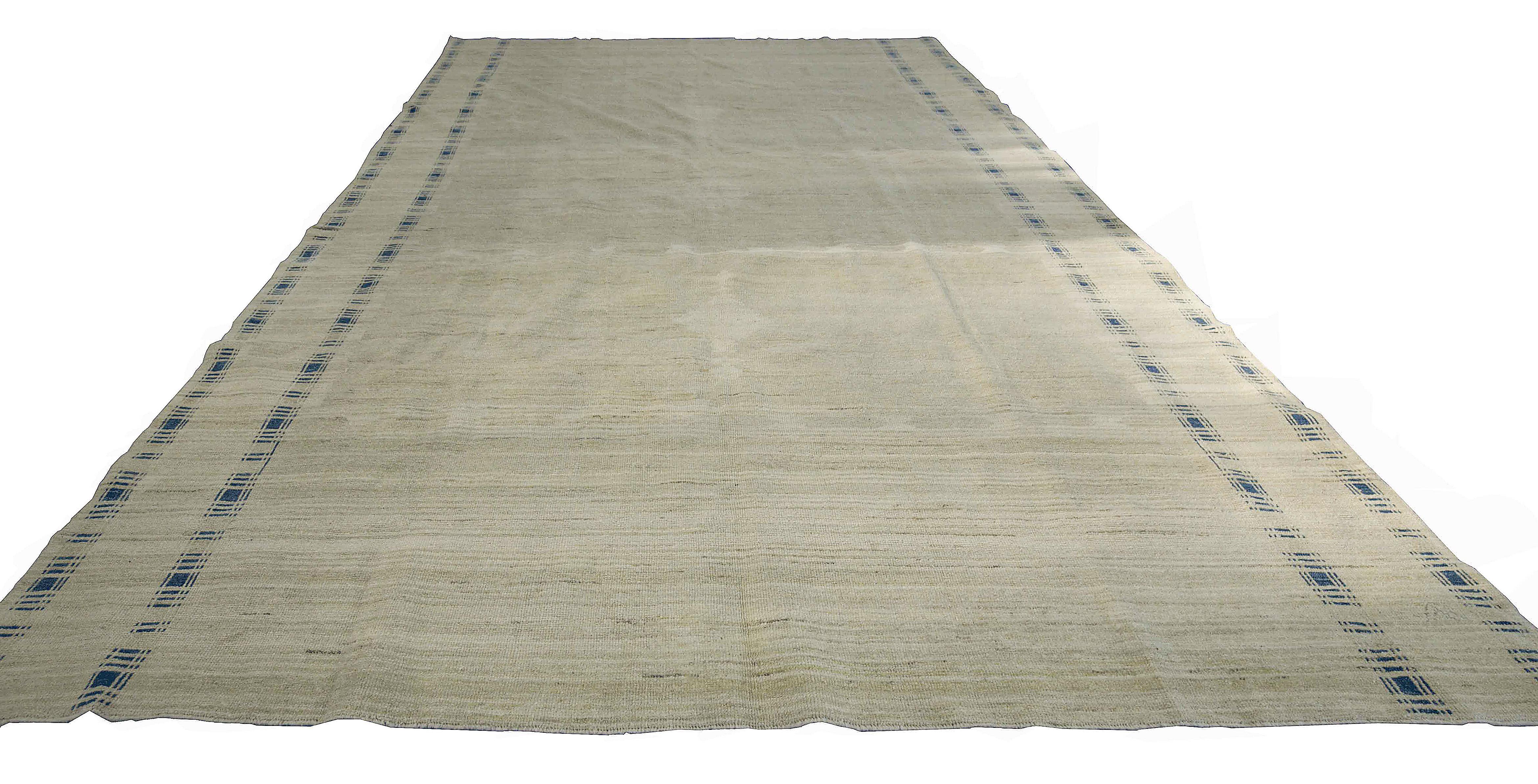 Contemporary Turkish rug made of handwoven sheep’s wool of the finest quality. It’s colored with organic vegetable dyes that are certified safe for humans and pets alike. It features a gorgeous beige field with medallion details in white and has a