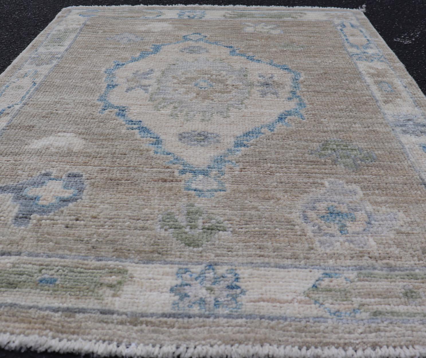 Measures: 2'0 x 2'8 
Modern Oushak Rug with Taupe Accents of Sky Blue and Sage Green 2'0 x 2'8. Keivan Woven Arts; rug AWR-137 Country of Origin: Afghanistan Type: Oushak Design.

This Modern Oushak rug showcases a timeless design that combines