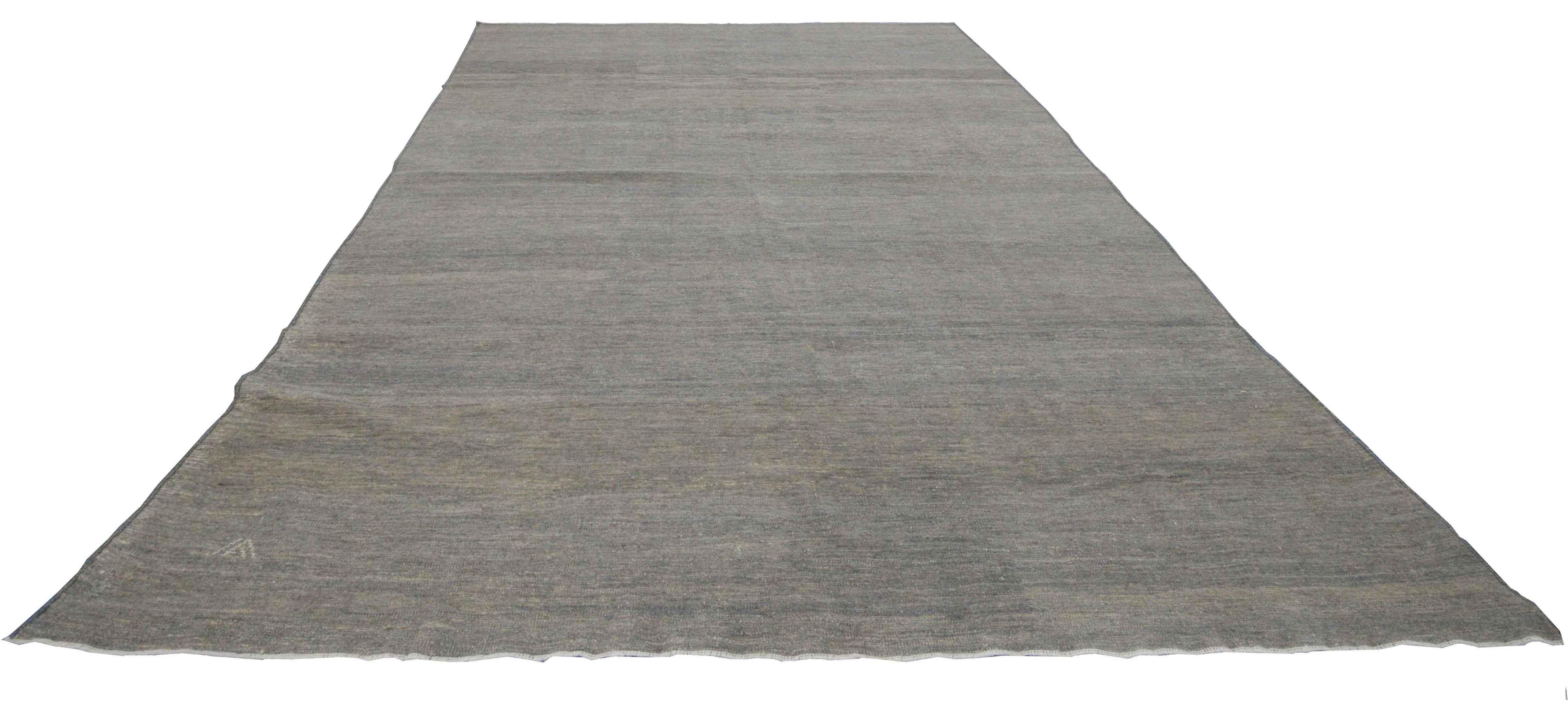 Modern Turkish runner rug made of handwoven sheep’s wool of the finest quality. It’s colored with organic vegetable dyes that are certified safe for humans and pets alike. It features a beautiful beige field with ‘invisible’ floral details in gray