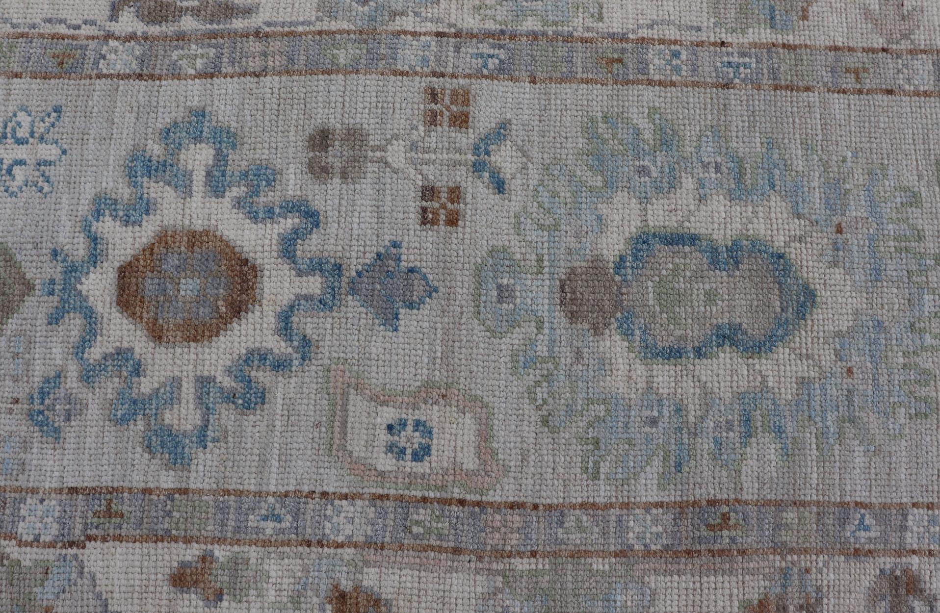 Hand-Knotted Modern Oushak Runner on Light Cream Field and Colorful Motifs Of Blue & Green For Sale