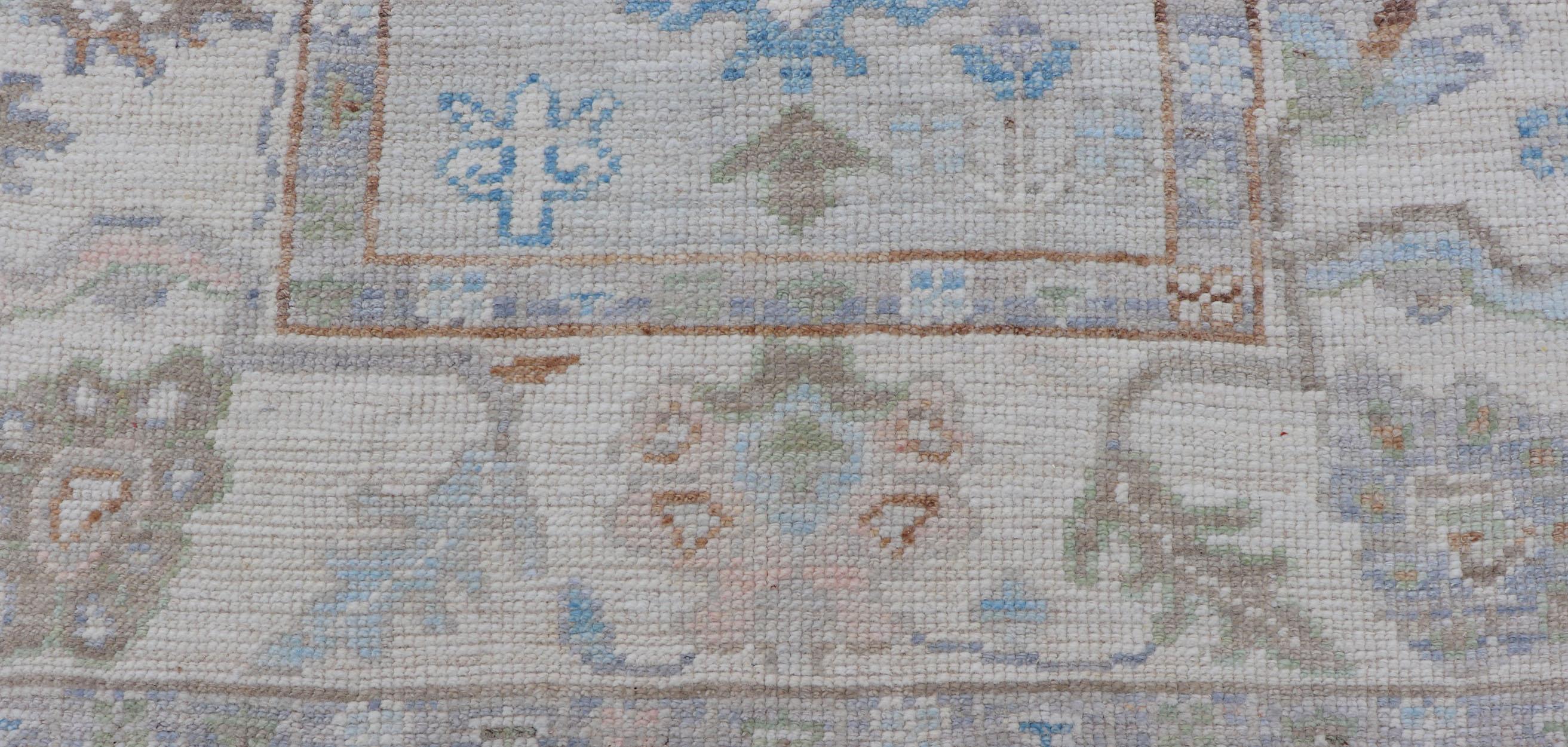 Modern Oushak Runner on Light Cream Field and Colorful Motifs Of Blue & Green In New Condition For Sale In Atlanta, GA