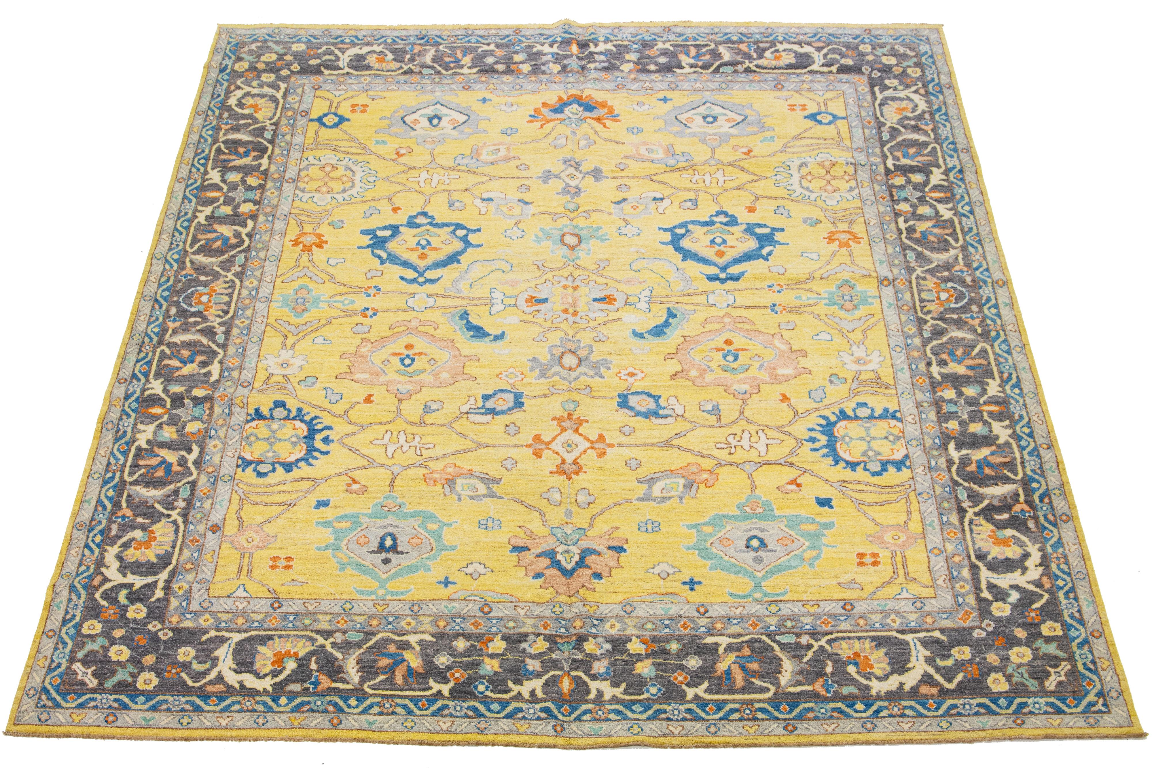 This wool rug displays a modern aesthetic with its Oushak-style design. It showcases a hand-knotted yellow field that is embellished with diverse, vibrant floral patterns that extend across the entirety of the rug.

This rug measures 12'5