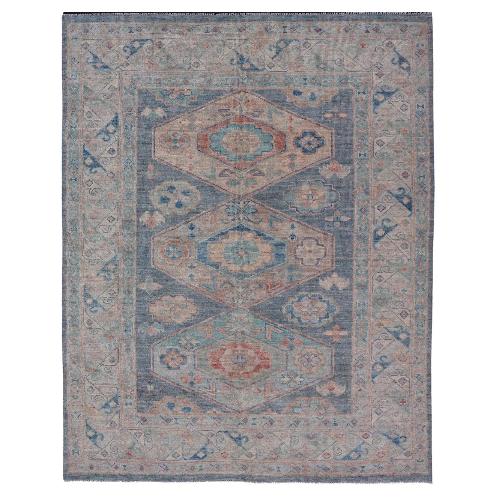 Modern Oushak with Large Medallion Design on a Blue-Gray Field For Sale