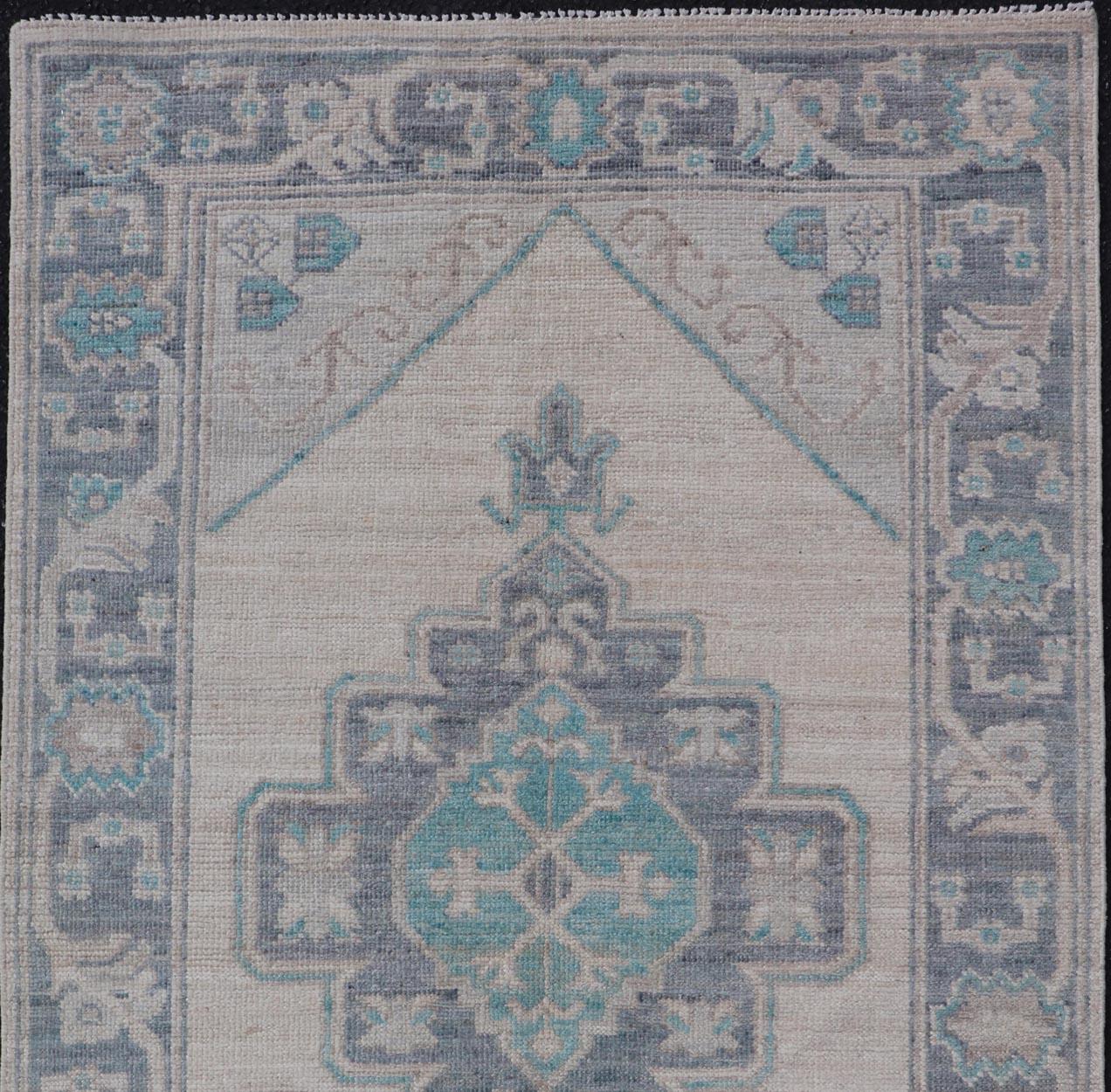 Modern Oushak with Off White Background with A Large Tribal Medallion in Teal  For Sale 1