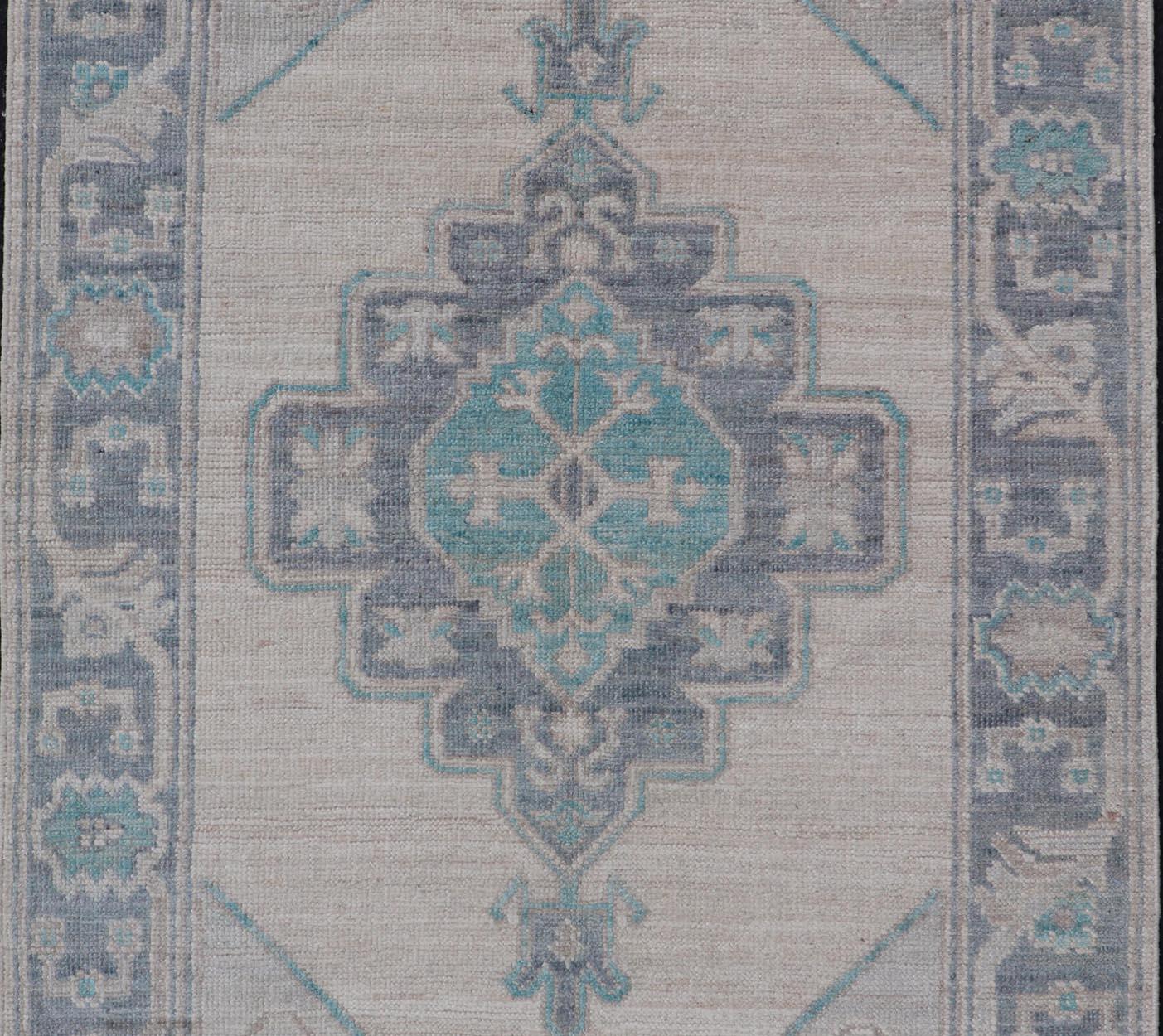 Modern Oushak with Off White Background with A Large Tribal Medallion in Teal  For Sale 2