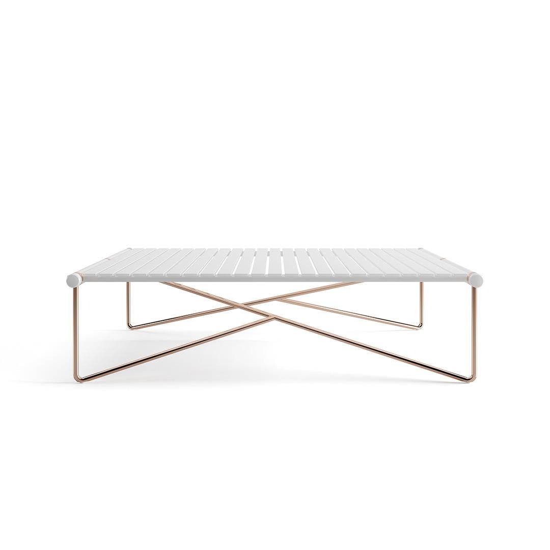 The whole design of this sophisticated outdoor center table was developed according to the following structure: 
-Top: White matte lacquered aluminum and stainless steel;
-Legs: Gold plated stainless steel;
-Details: Gold-plated stainless