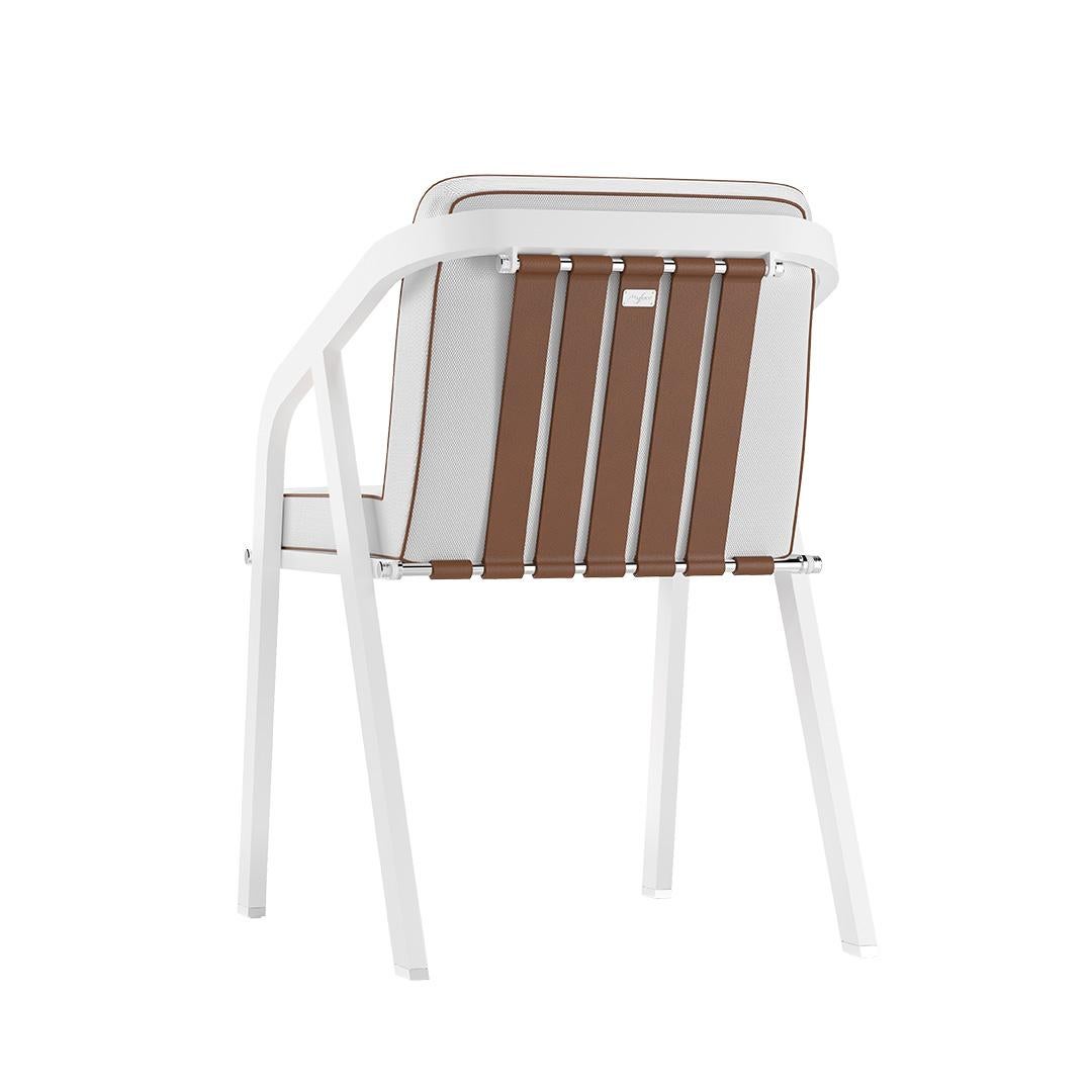 Ribbon - Outdoor dining chair.
Contemporary outdoor dining chair made with structure: white lacquered aluminum, metallic details: nickel-plated, upholstery: acrylic fabric, pipping: outdoor leather, straps: outdoor leather

Due to its well-defined