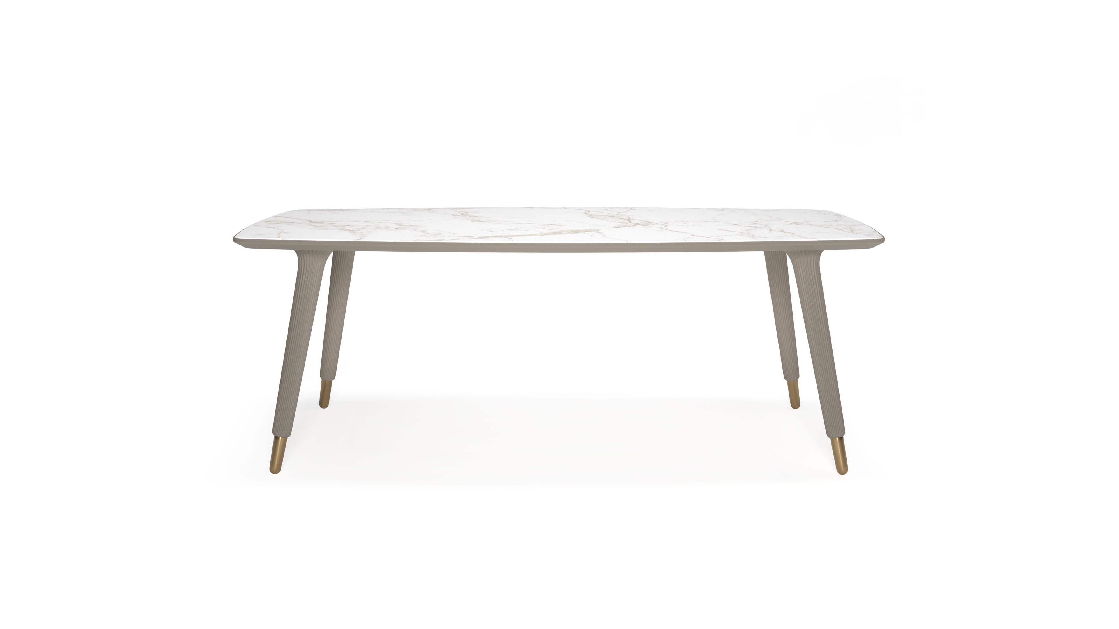 Eleanor Rectangular Dining Table

The Eleanor dining table is a piece of furniture  that takes functionality and simplicity of design as its starting point. 
In addition to its feminine curves and the wavy texture of the legs, the gold details on
