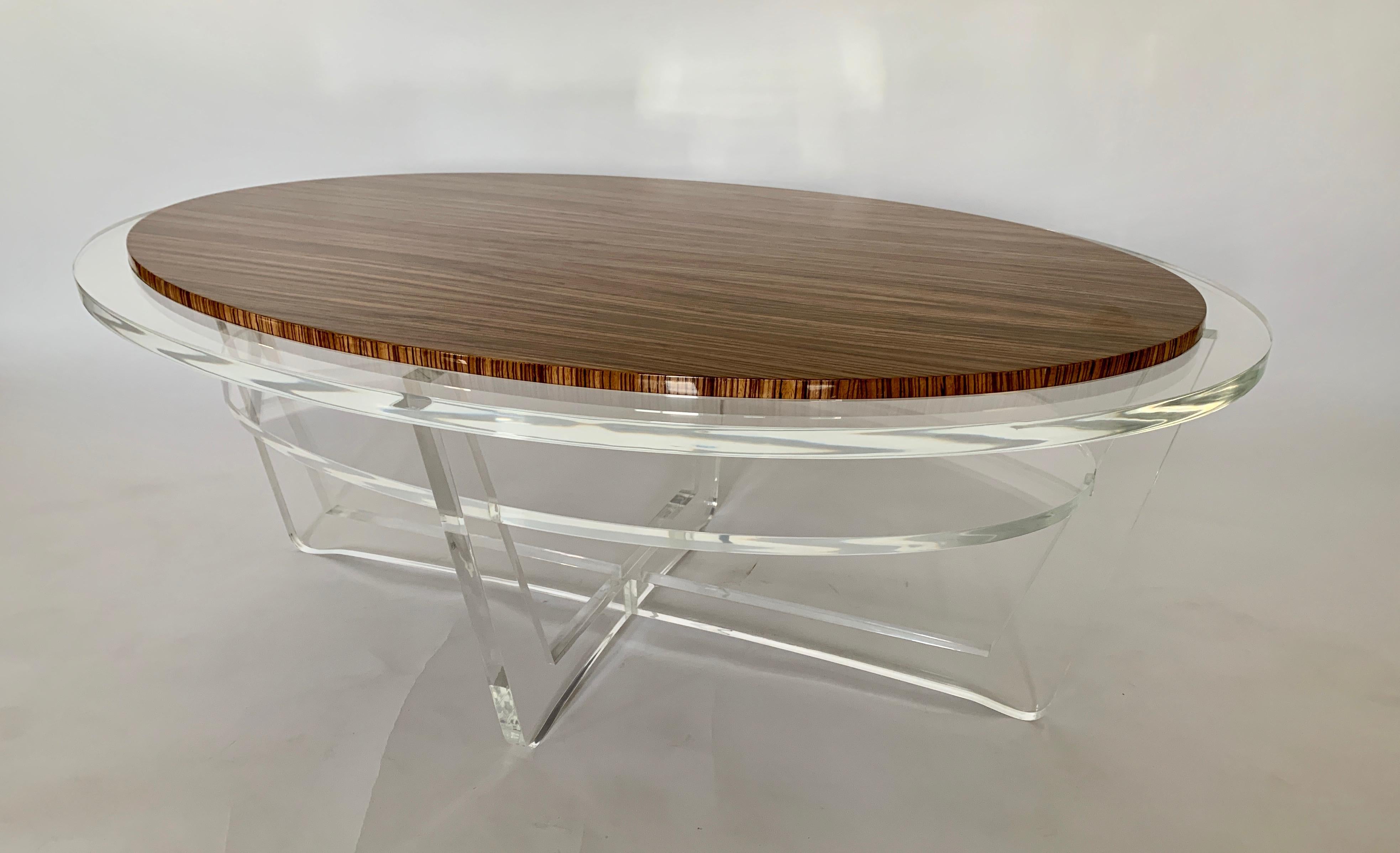 This Jonathan Franc Cocktail Table has an oval Zebra wood inset top with a 3