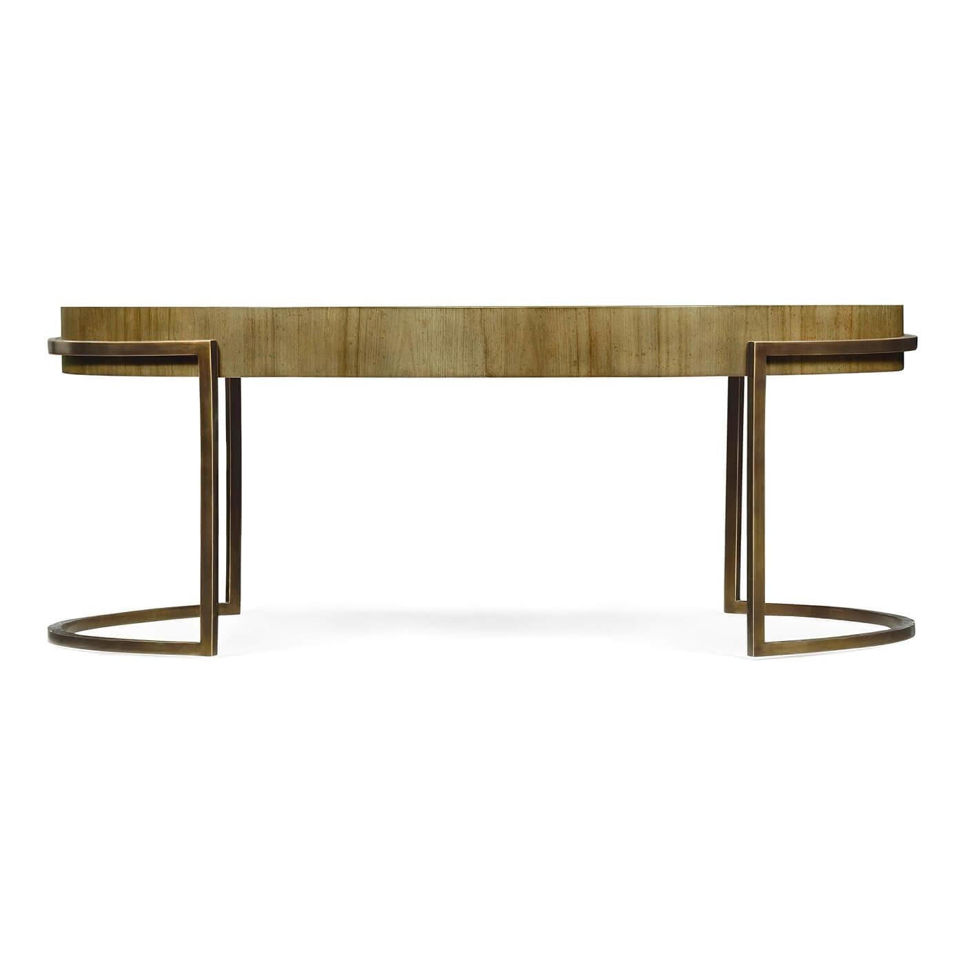 Modern oval chestnut coffee table with a light bronzed finish iron trestle support base. 

Dimensions: 50