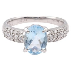 Anello moderno in platino con diamante e acquamarina dal taglio ovale