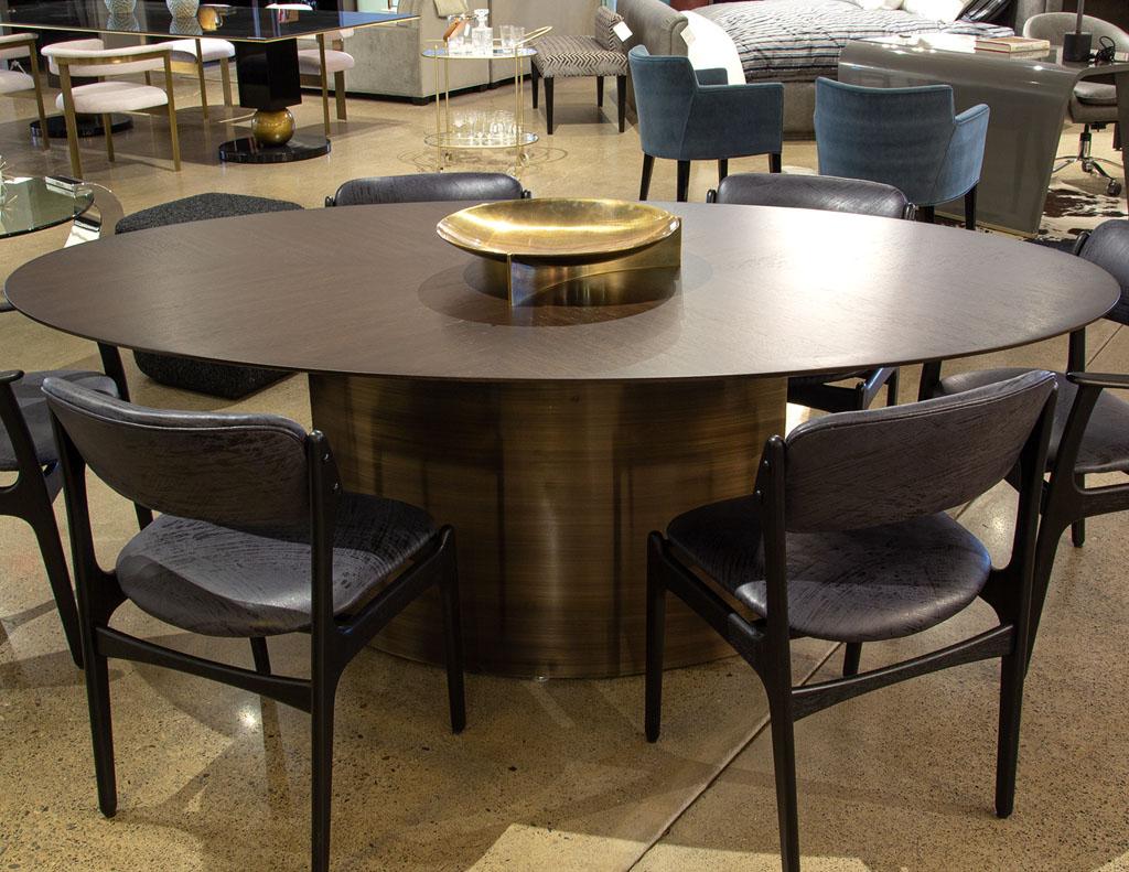 Modern Oval Oak Dining Table with Curved Metal Pedestals For Sale 6