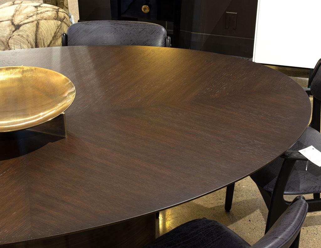 Modern Oval Oak Dining Table with Curved Metal Pedestals For Sale 9