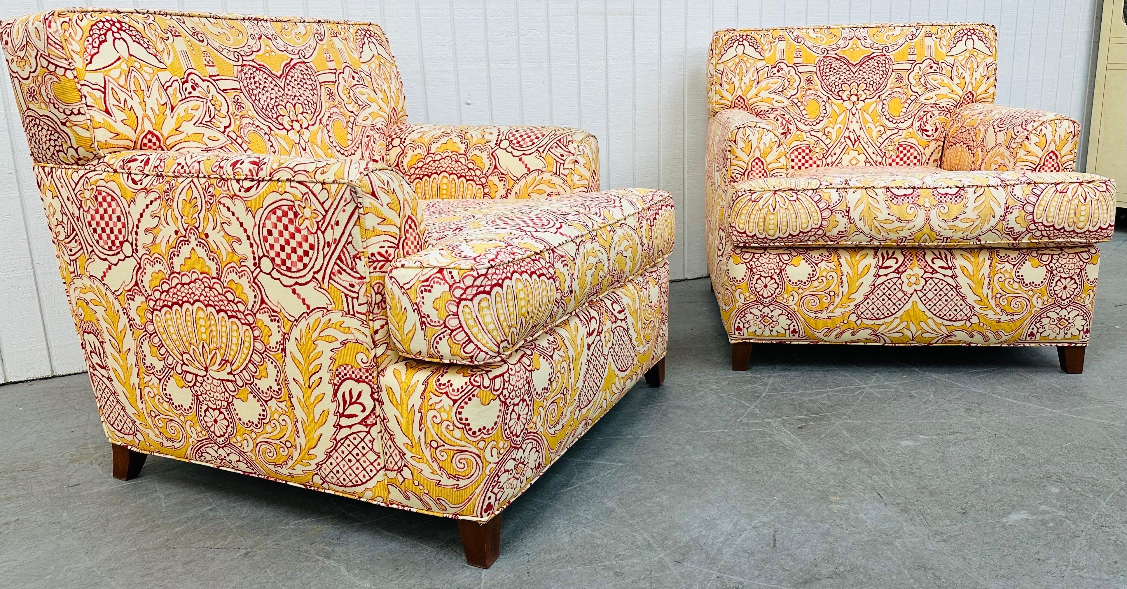 This listing is for a pair of Modern Oversized Floral Club Chairs. Featuring a straight line design, bright decorative floral upholstery, modern legs, and comfy cushions. This is an exceptional combination of quality and design by Shuster Design