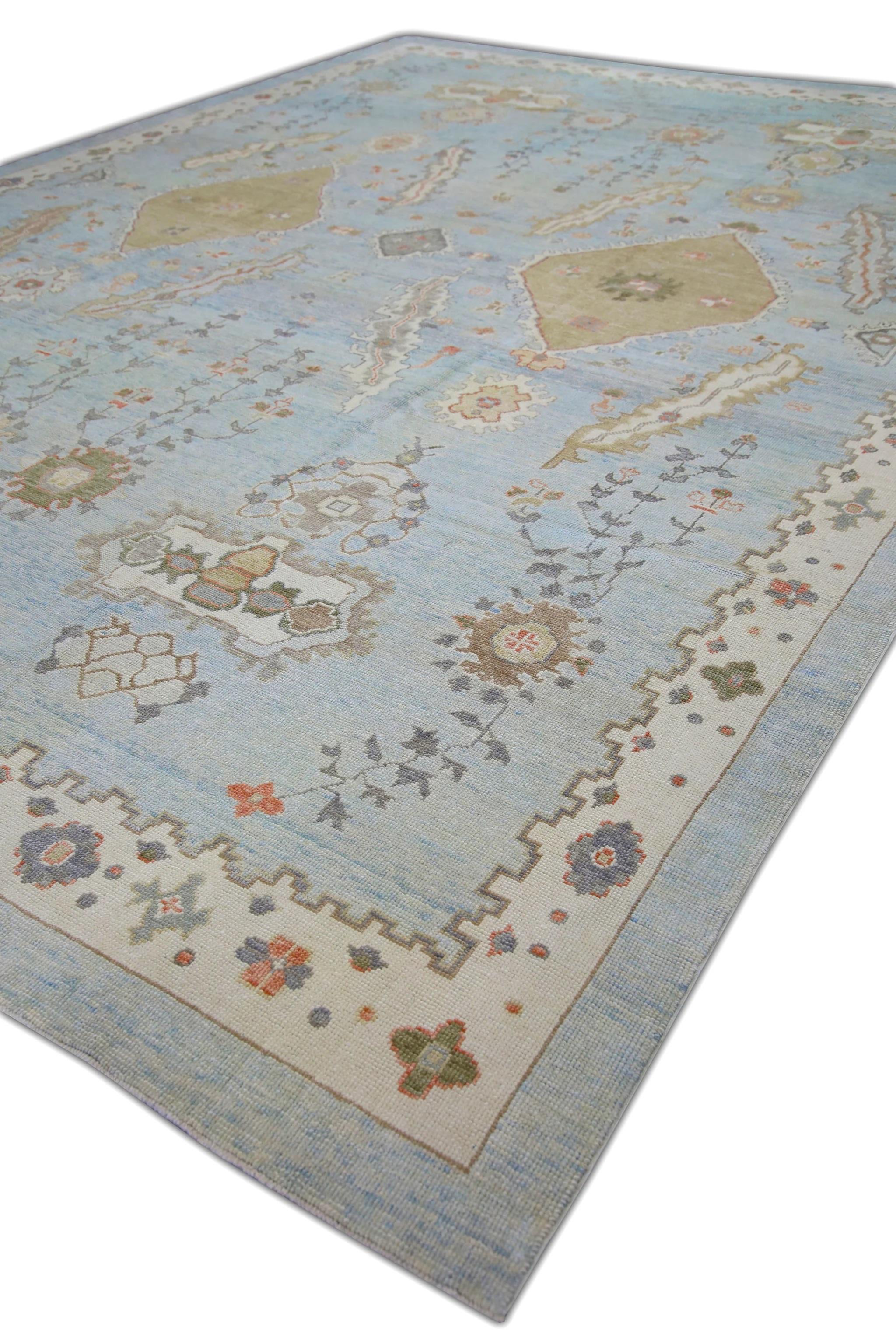 This modern Turkish Oushak rug is a stunning piece of art that has been handwoven using traditional techniques by skilled artisans. The rug features intricate patterns and a soft color palette that is achieved through the use of natural vegetable