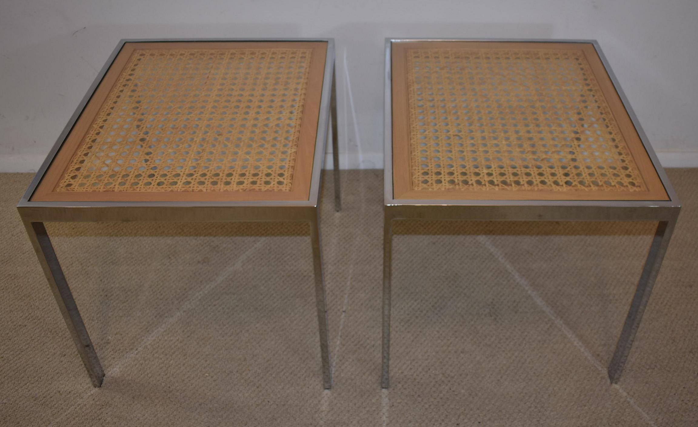Pair of Mid-Century Modern chrome and cane side tables in the style of Milo Baughman. Very nice to excellent condition. Dimensions: 22