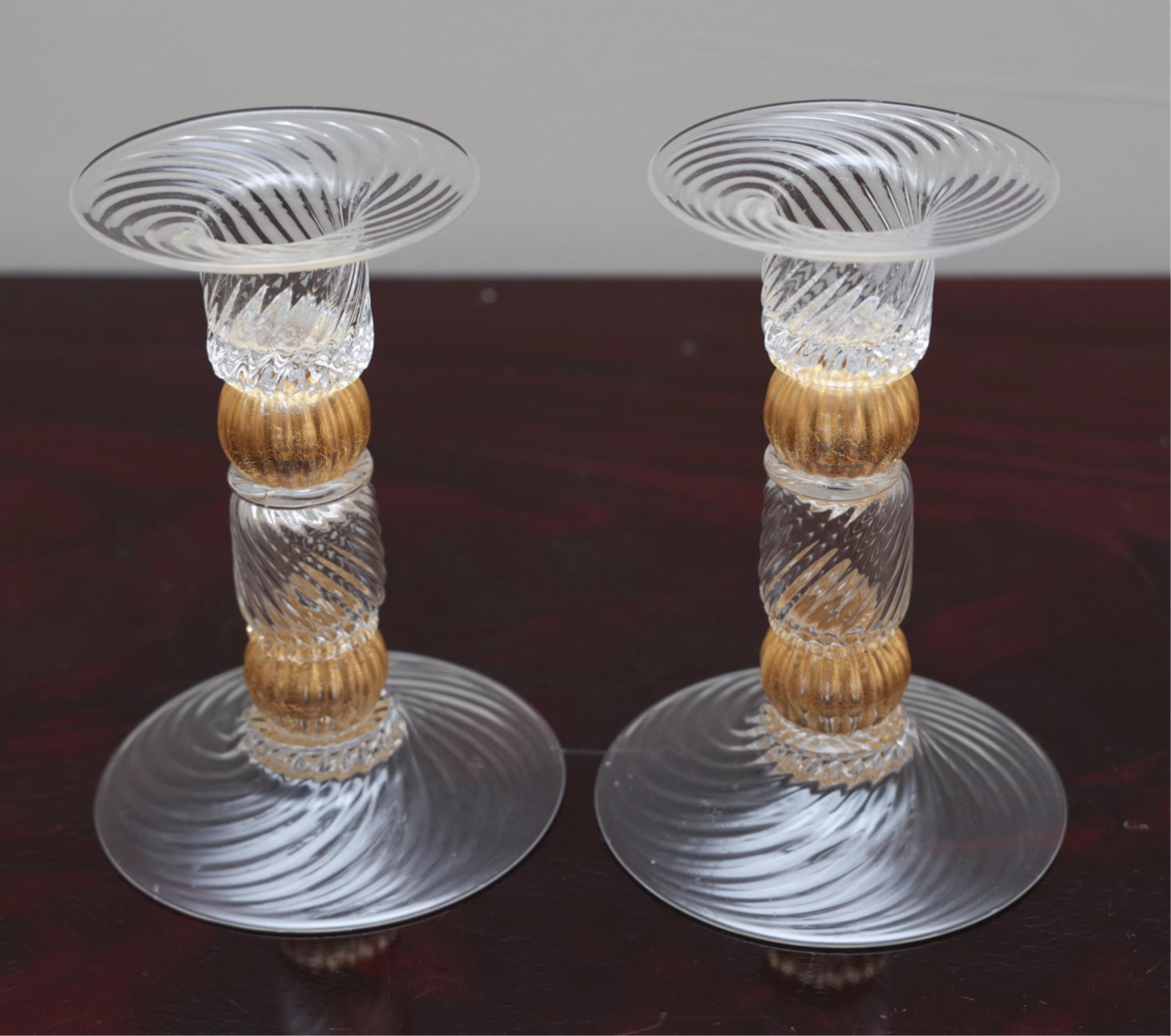 A modern pair of Lorin Marsh Murano clear and gold flecked swirl art glass candlesticks
Dimensions: Height 5.75