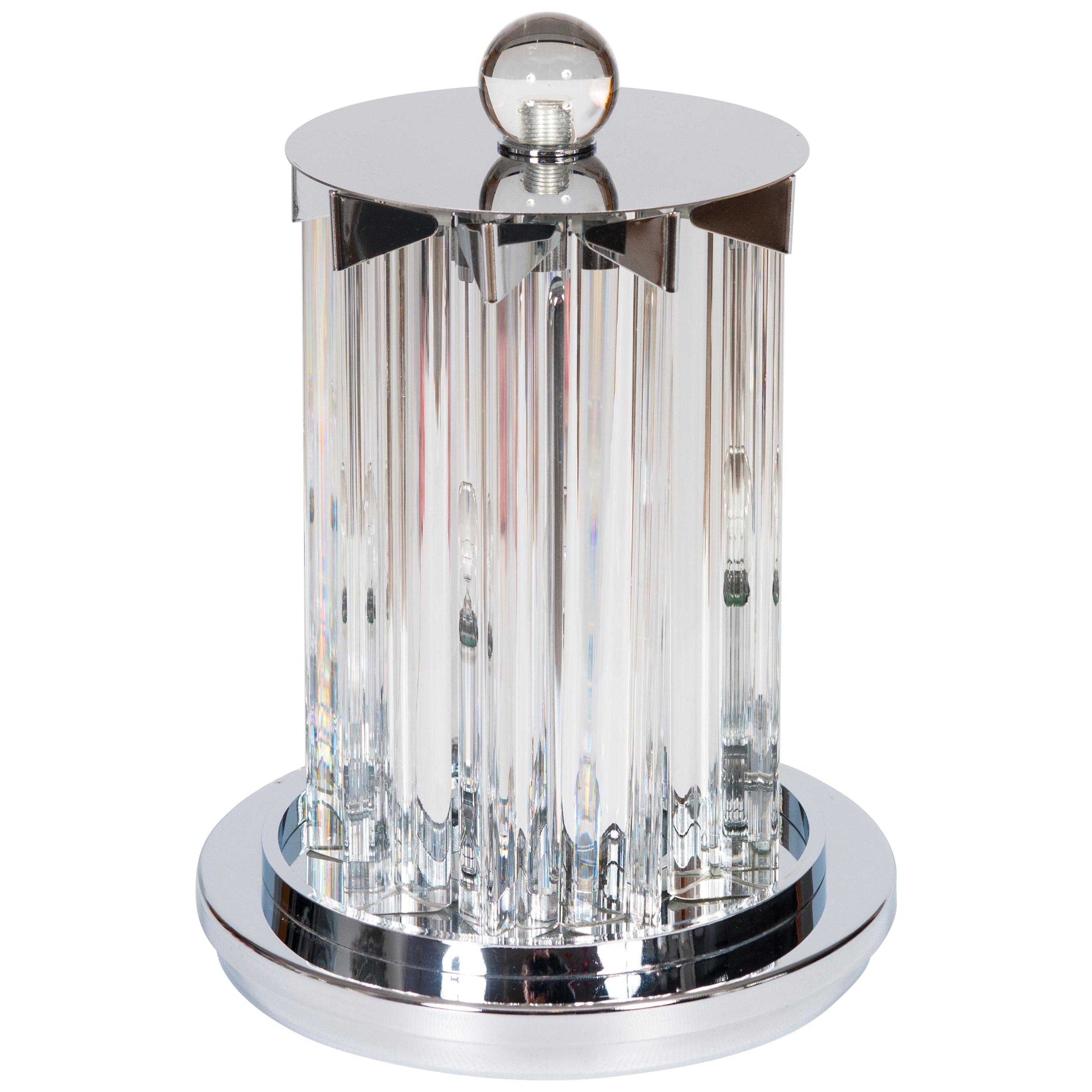 Pair of contemporary Murano glass table lamps, 21st century.
They are entirely hand crafted in blown Murano glass, and all the elements are clear color and accommodated in an handcrafted chromed framework. Each table lamp is composed by 9