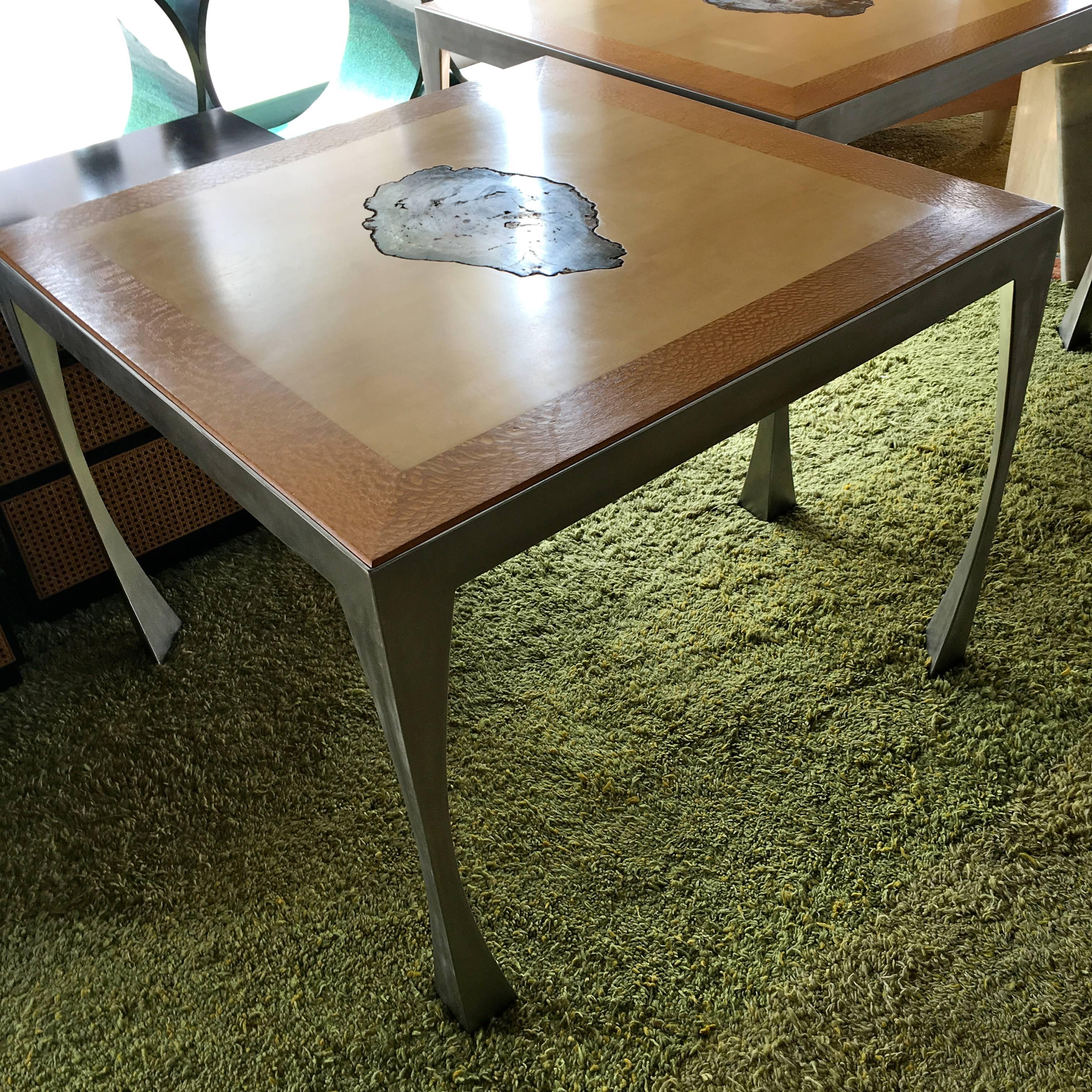 This pair of very well made tables were custom made by the architect of a very uber contemporary/modern Bighorn Country Club Residence in the early 1990s. They are perfectly inset with a slice of beautiful naturally colored petrified wood in the
