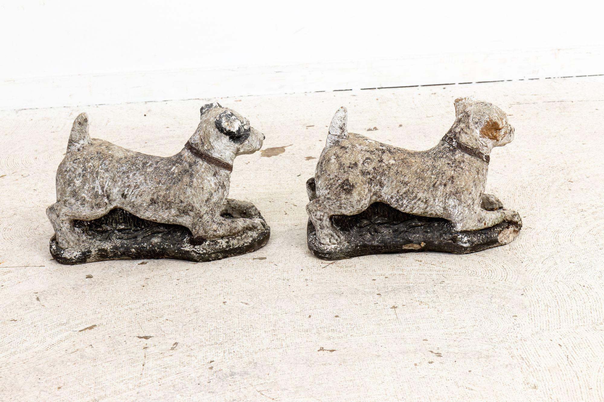 This delightful pair of English mid-20th century garden ornaments features charming depictions of Jack Russell Terriers. Crafted with meticulous attention to detail, these canine sculptures exude a timeless appeal. While the passage of time has left