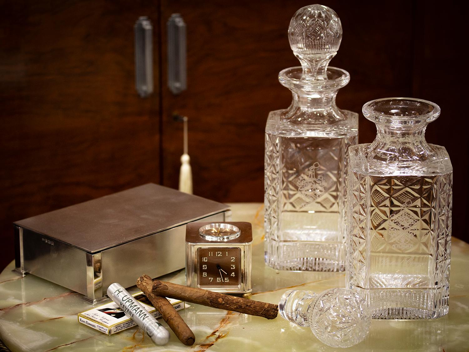 Featuring a Coat of Arms

From our Decanter collection, we are pleased to offer this pair of Scottish Glass Magnum Sized Decanters. The decanters of square form with canted corners featuring a quilted pattern to each face except the front which is