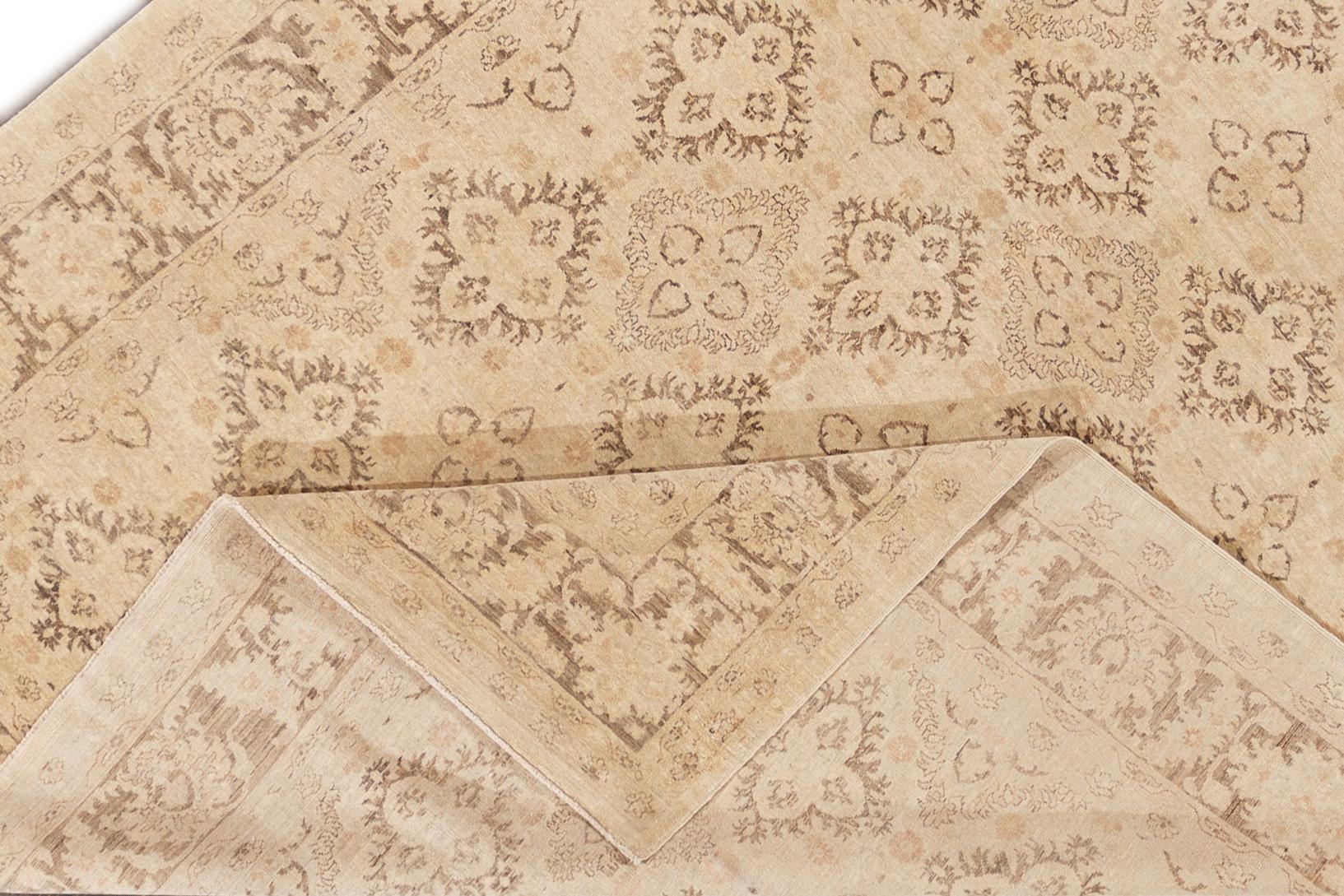 A hand-knotted modern Paki Peshawar rug with an all-over beige floral design. This rug measures 7'9