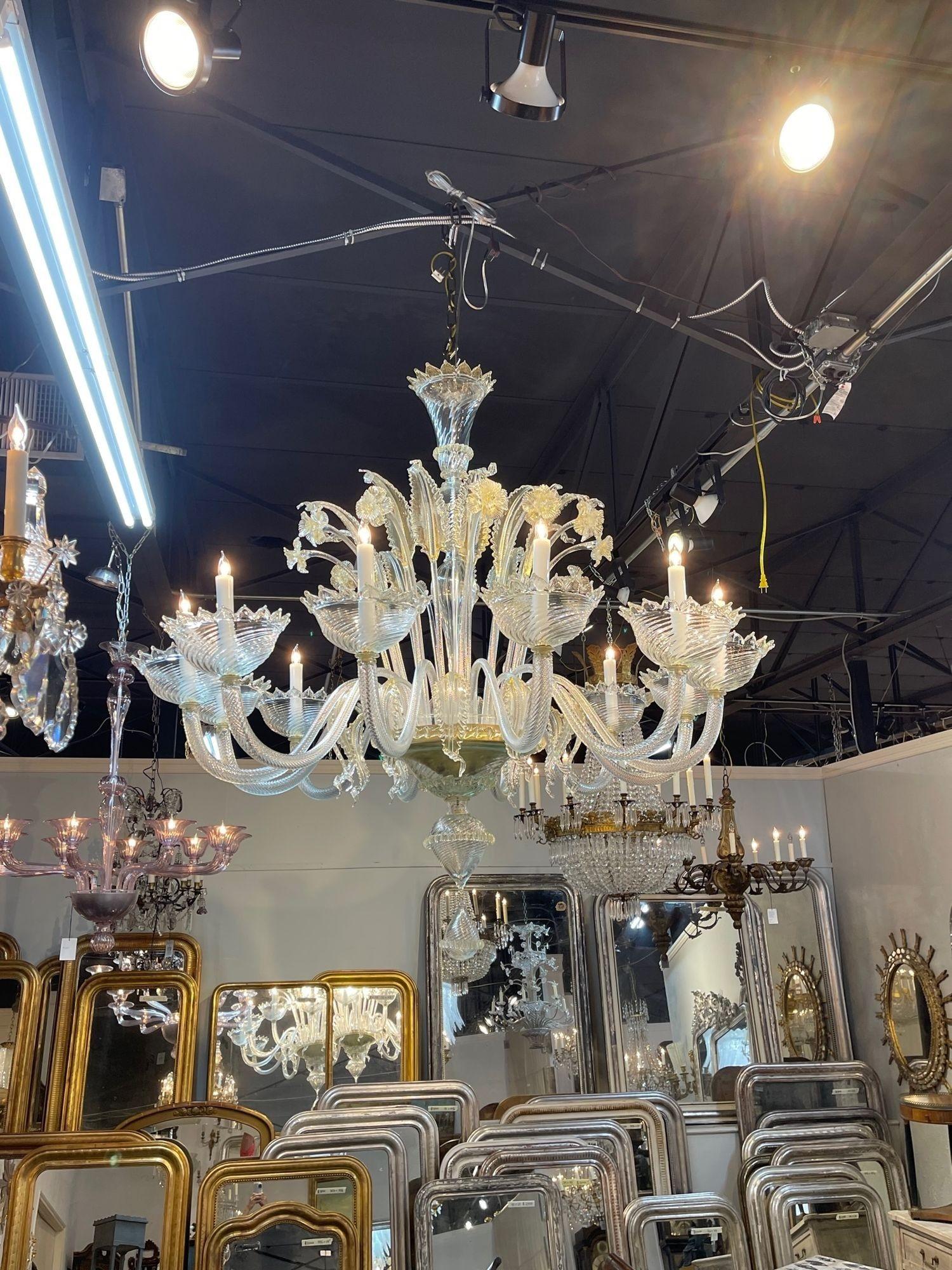 Modern palace size Venetian gold glass chandelier with 12 arms. Featuring beautiful gold glass with decorative leaves and flowers and beautiful curved arms. A true work of art. Stunning!!.