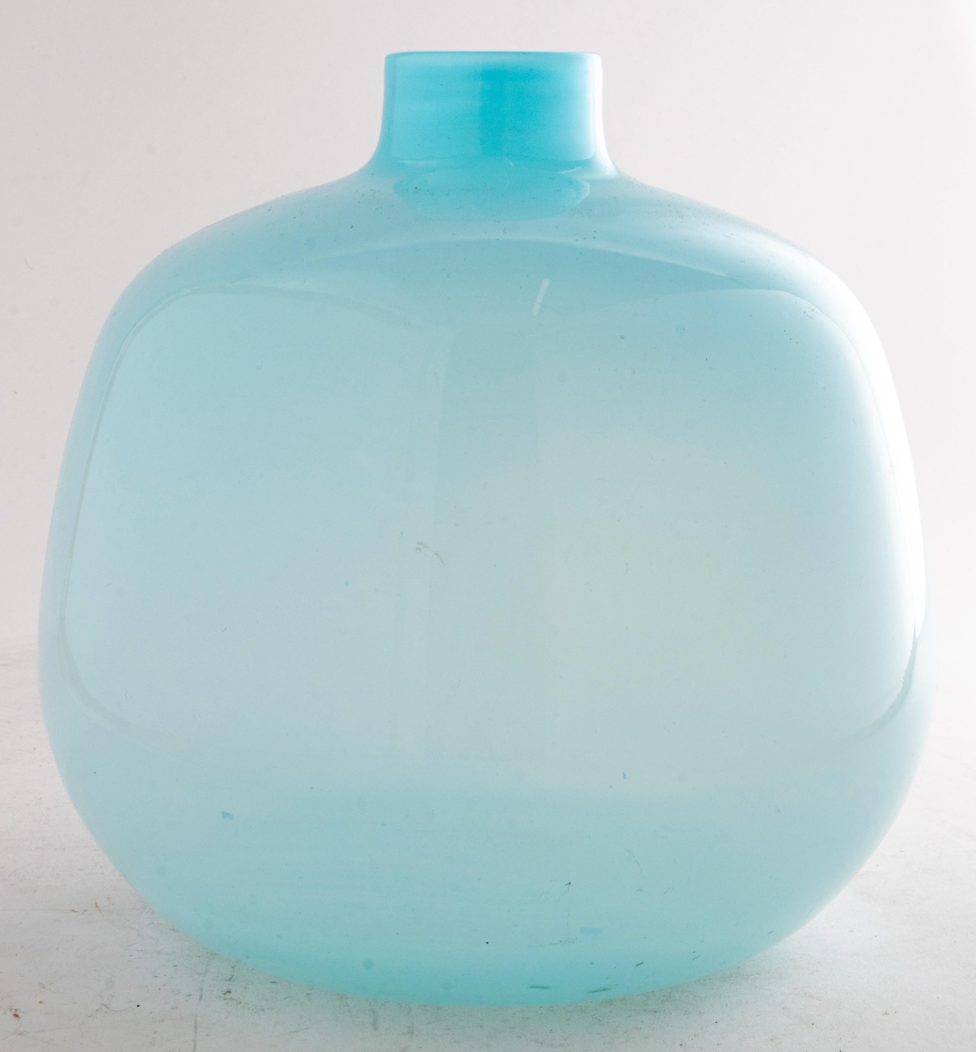 Modern glass vase in pale blue glass with short bottle neck, unmarked. 

Dimensions: 8