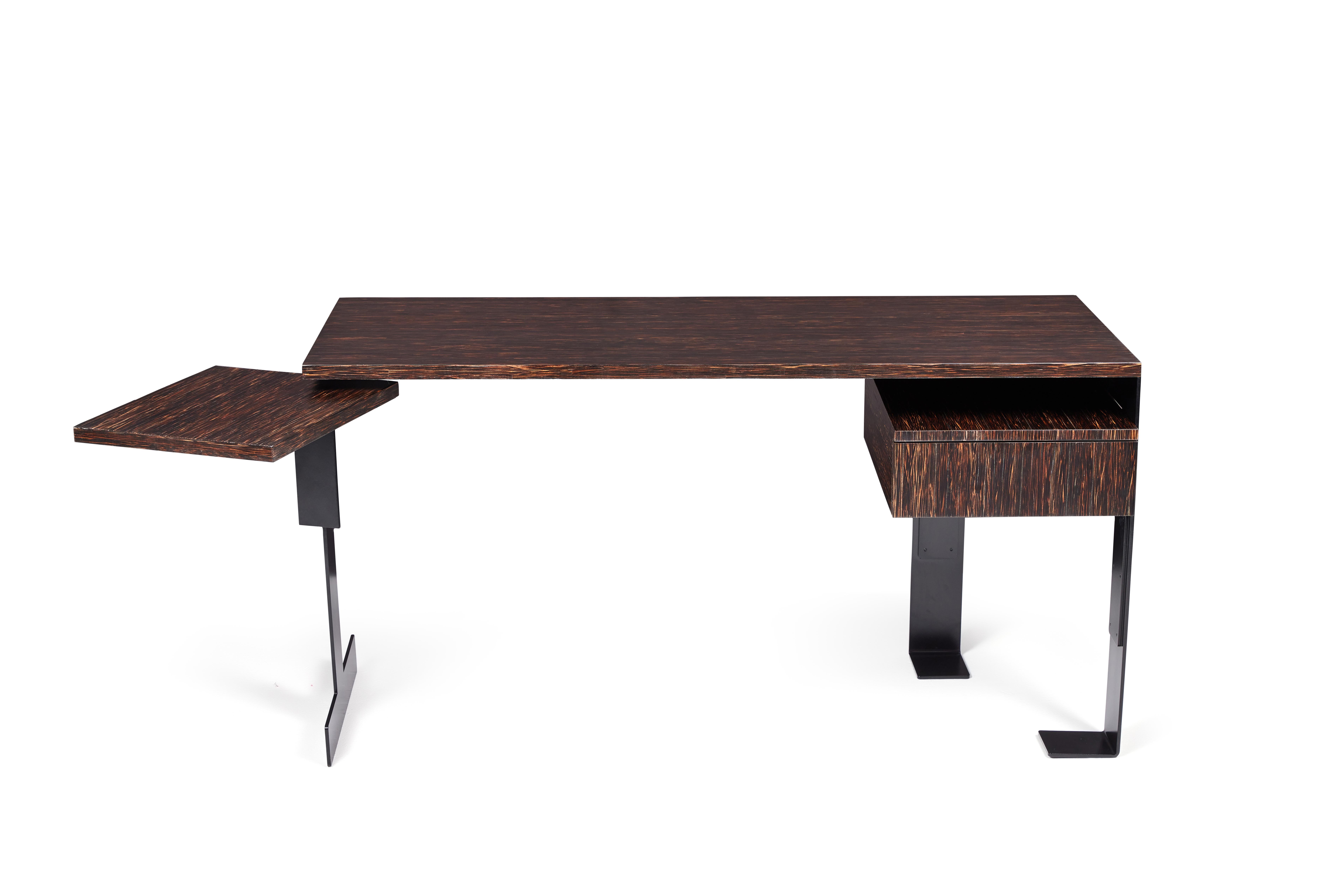 Inspired by the refined modernism of Pierre Chareau, this desk combines architectural presence with understated elegance. The base is crafted from forged steel with a black satin powder-coated finish, lending a strong, sculptural foundation. The