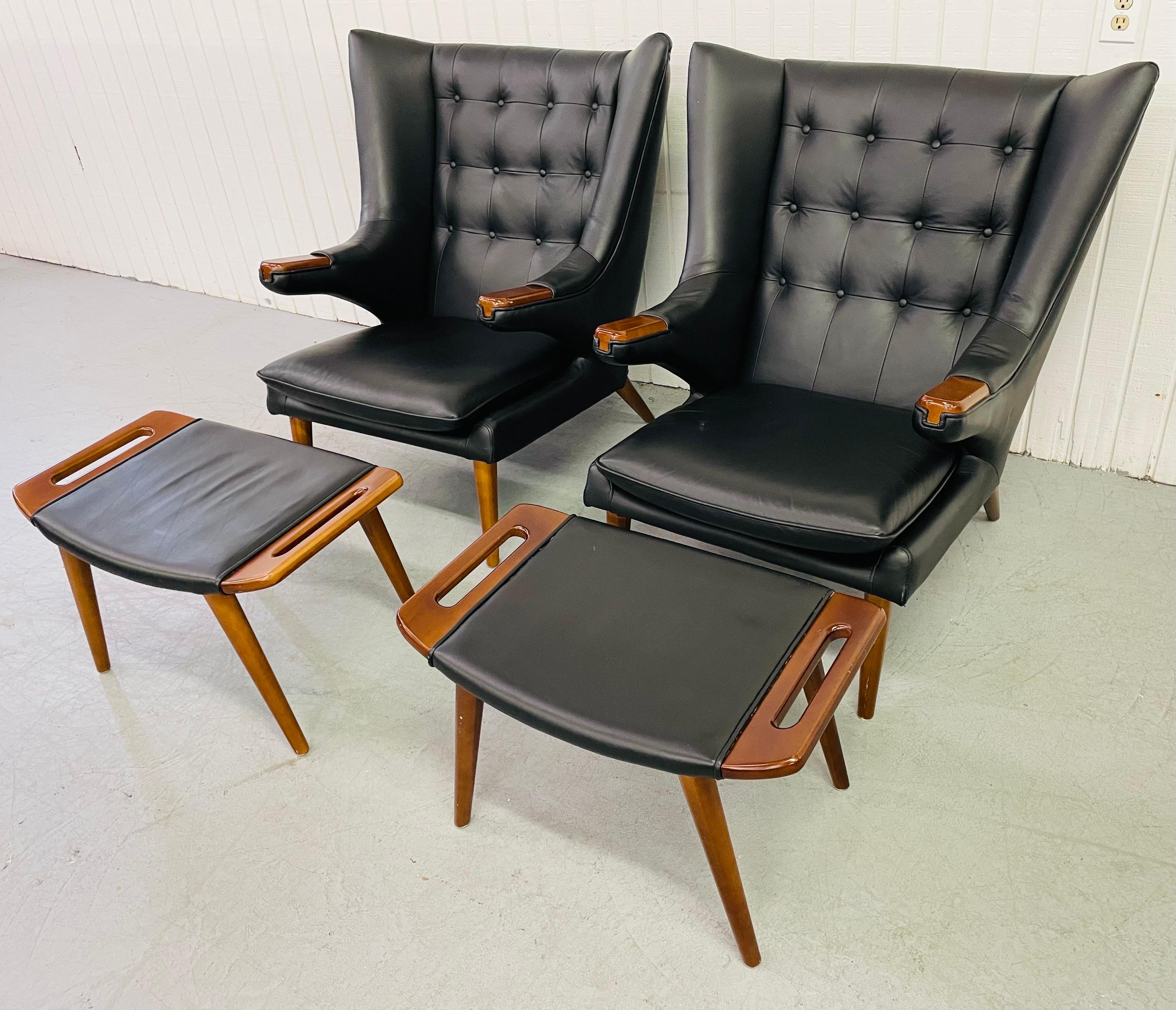This listing is for a set of two Modern papa bear wing chairs. Two matching ottomans included. Featuring black leather upholstery, tufted backs, wood arms and legs. These are an extraordinary reproduction of Hans Wegner’s Papa Bear Chair.

Ottoman