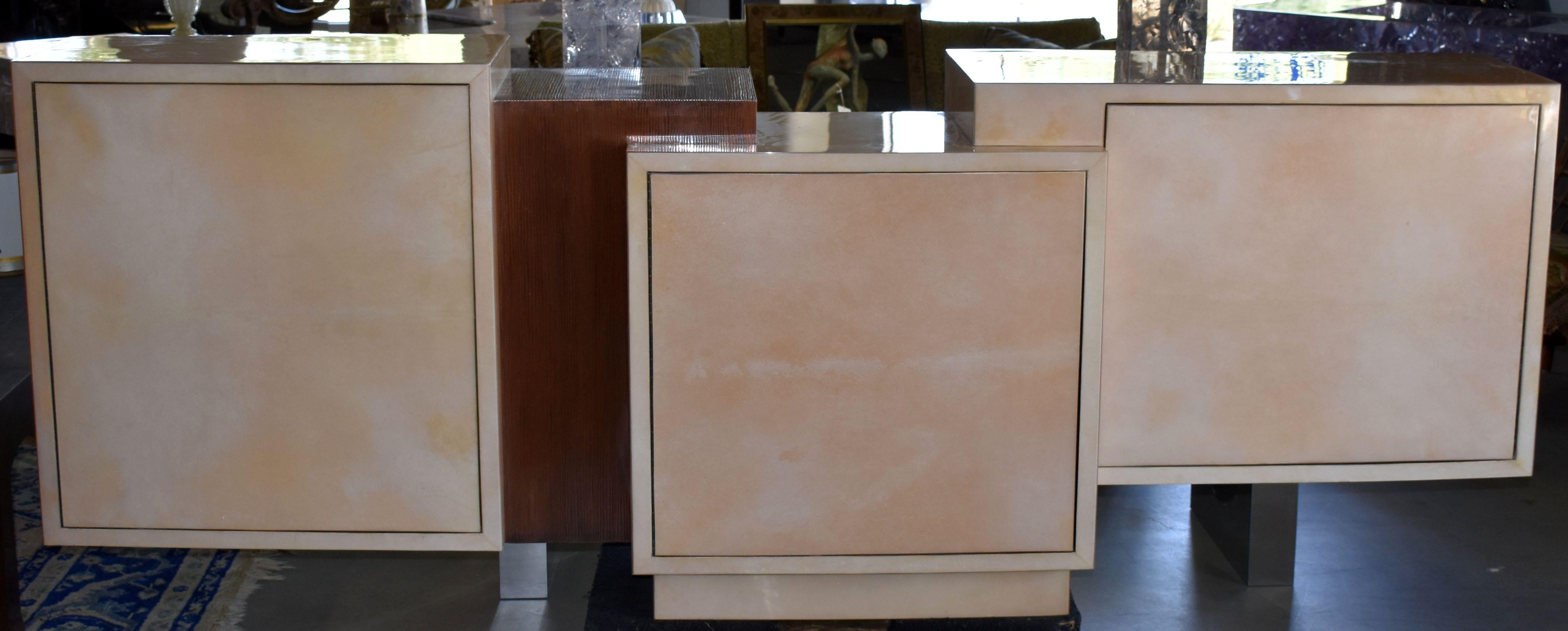 Elegant artistic design sideboard cover with goatskin and finish with resin and copper. Credenza has three doors with glass shelves and cover with exotic wood.

Additional Dimensions:

D each side:
left side 17.5 inches middle side 20 inches