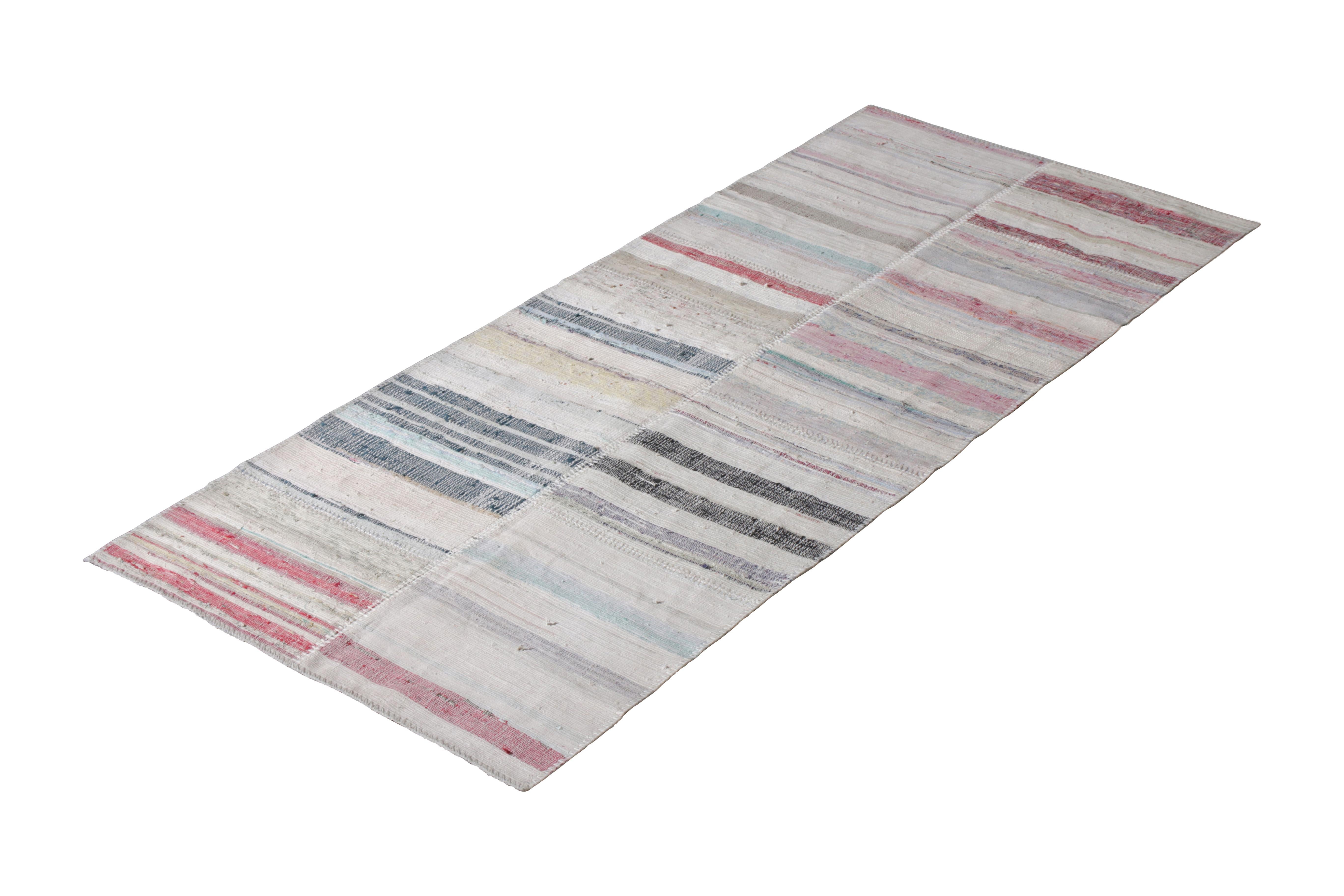 Handwoven in a wool flat-weave utilizing vintage yarns, this modern Kilim runner from Rug & Kilim’s Patchwork Kilim rug collection marries inspiration from midcentury Kilim rugs with a whimsical spectrum of red, blue, pink, green, and other