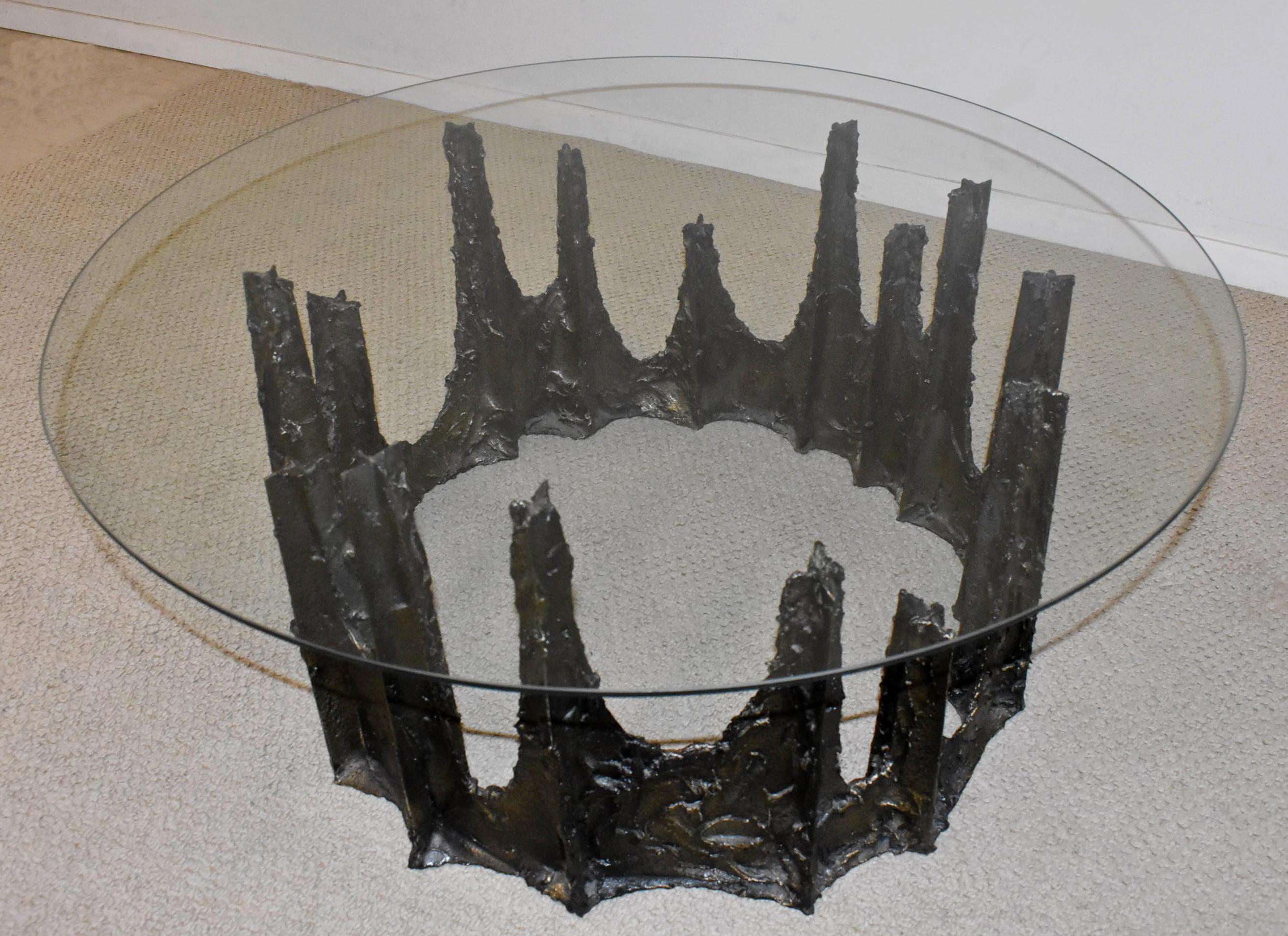 Modern round glass and stalagmite form coffee table. Original finish. Signed P E 69'. Glass is 1/4
