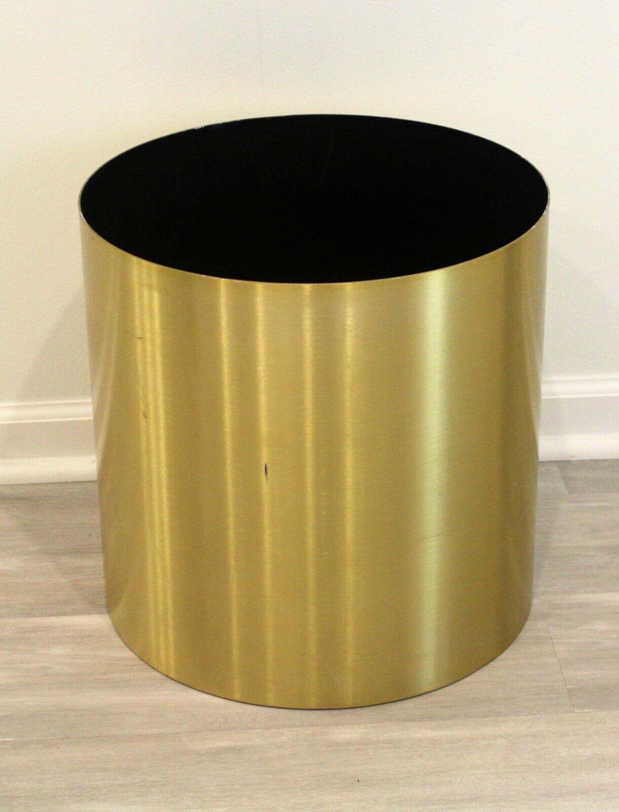 This drum planter by Paul Mayen accommodates larger scale foliage or trees. Made of brass, this modern and sleek planter works well in most modern and transitional homes.

Dimensions: 16.25 diameter x 16 height.