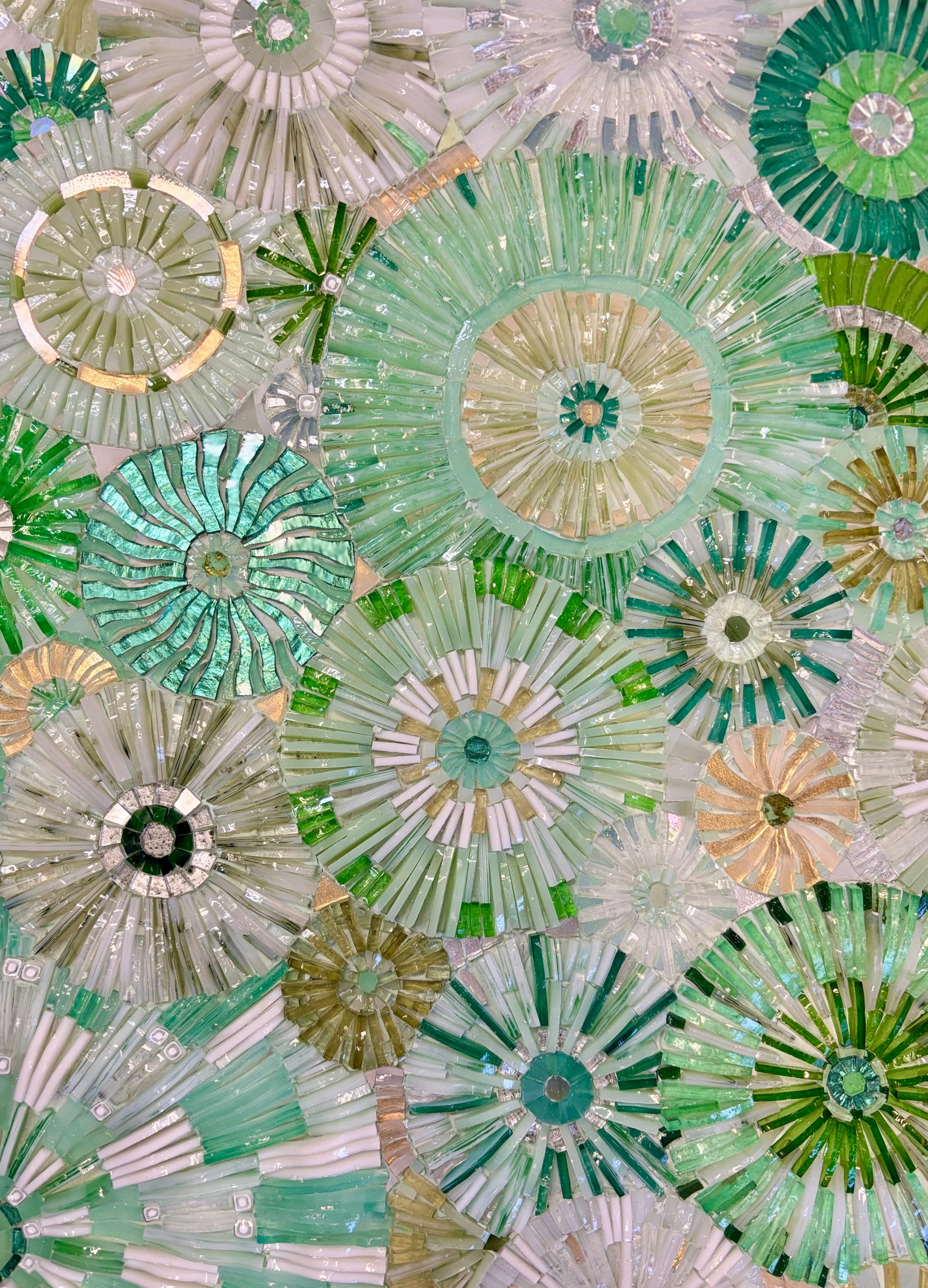 The Modern Pavia Blossom Console by Ercole Home features a hand-cut glass Blossom pattern mosaic top, raised above a silver leaf Pavia base. Hand-cut glass mosaic in a variety of shades of green, including Aqua and Seafoam.

Custom Sizes and