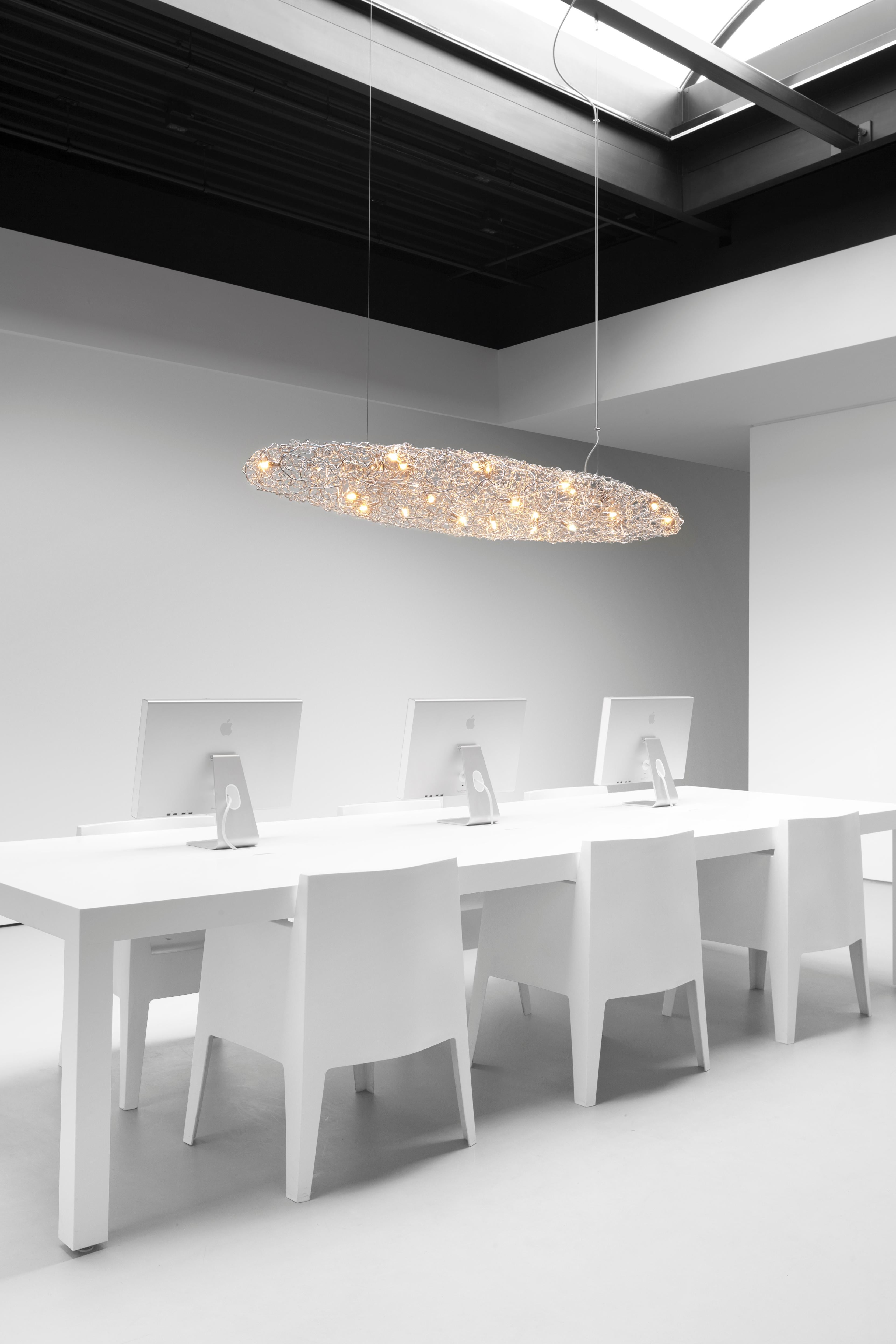 The Crystal Waters Cigar is a modern pendant designed by William Brand, founder of Brand van Egmond. The Crystal Waters collection, crafted by hand in a nickel finish, is available in various hanging lights, a ceiling light and a wall light. Custom