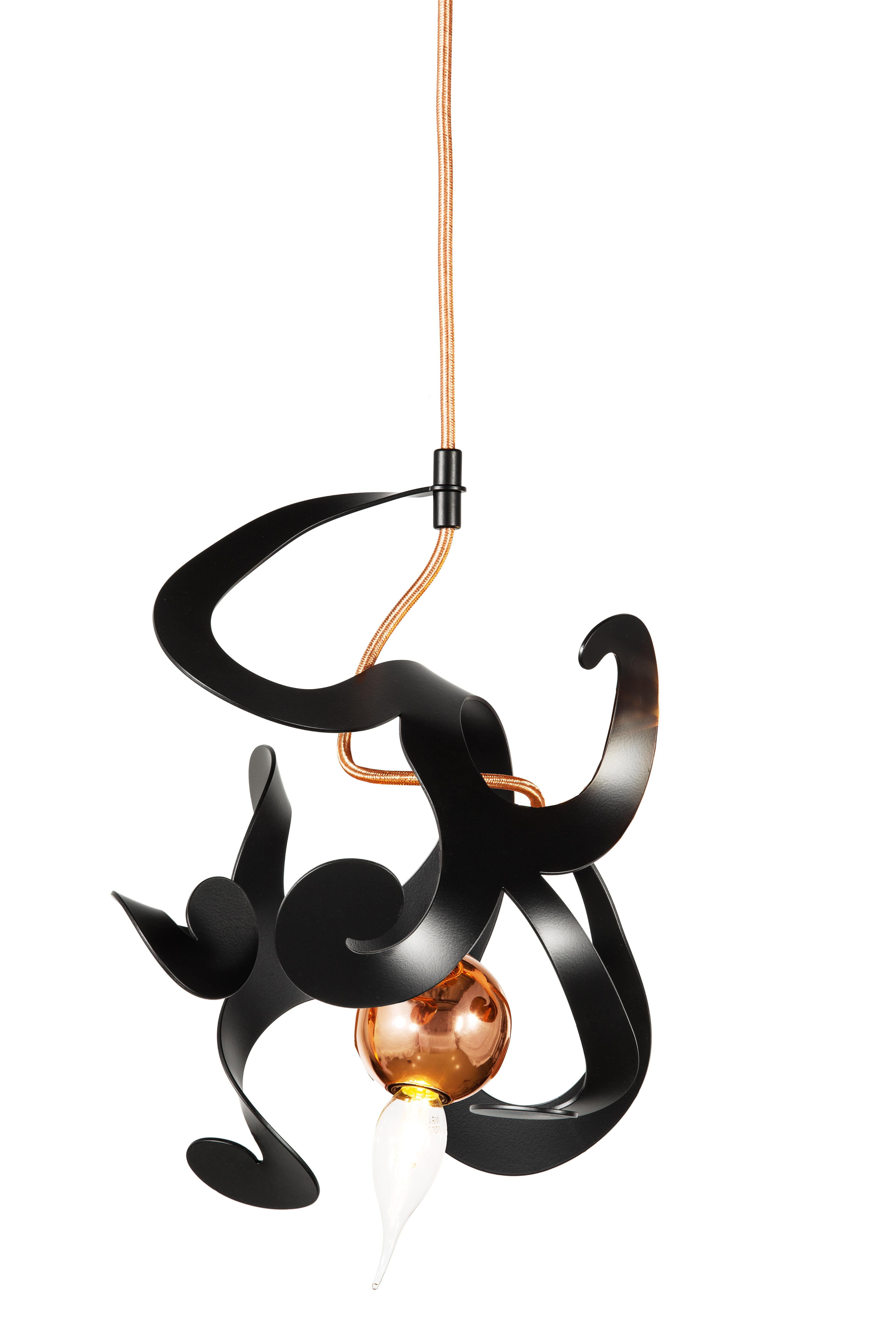 The Kelp modern pendant in a black matt finish, designed by William Brand, is a free and playful organic lighting sculpture in the collection of Brand van Egmond. The seemingly randomness of the lighting sculpture, yet carefully arranged ornaments