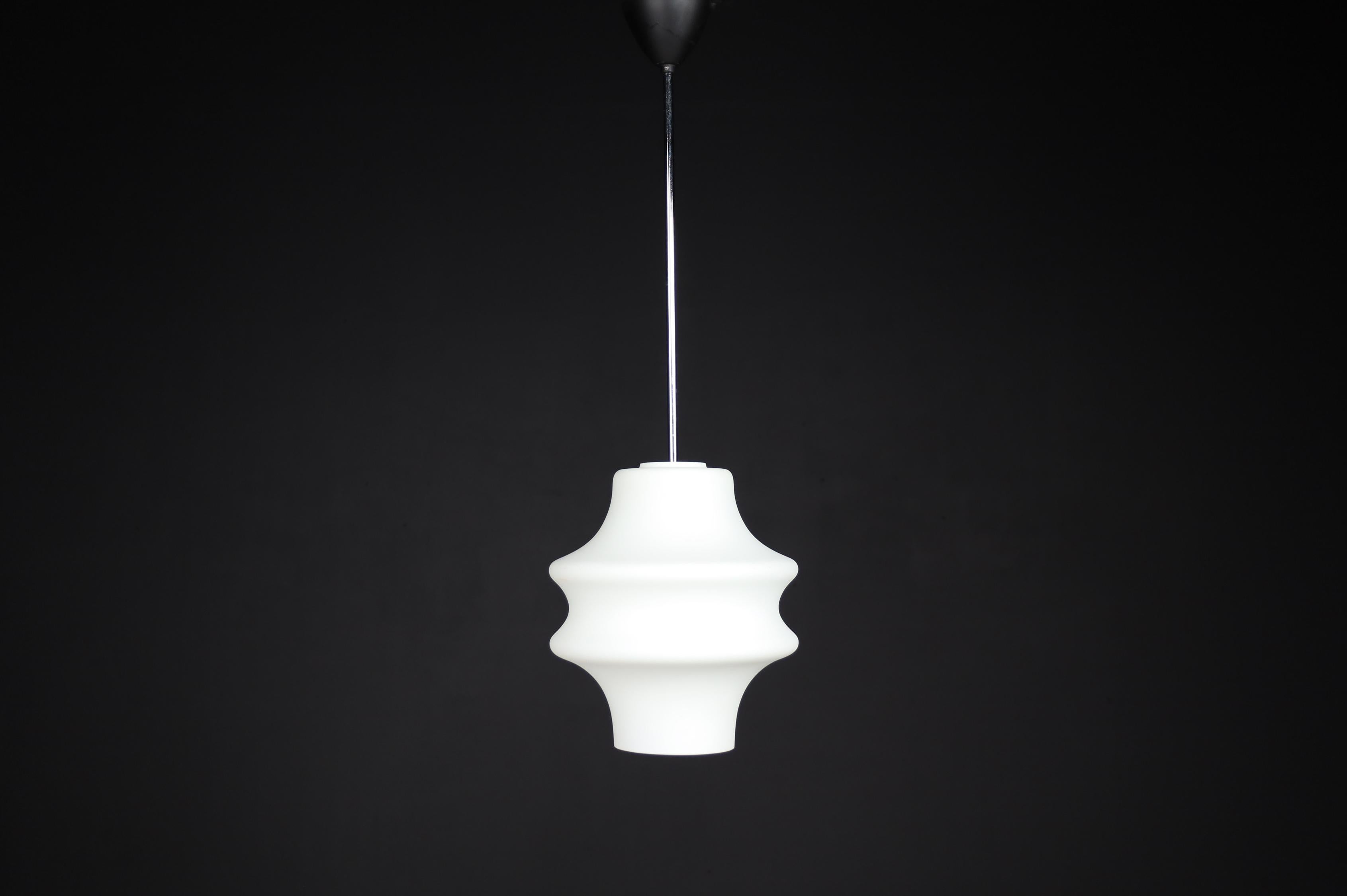 Modern pendants, opaline glass, Europe, the 1960s.

Modern pendants, opaline glass, Europe, the 1960s. The diffuse light it spreads is very atmospheric. Completed with opaline glass and metal frame details, these pendants will contribute to the