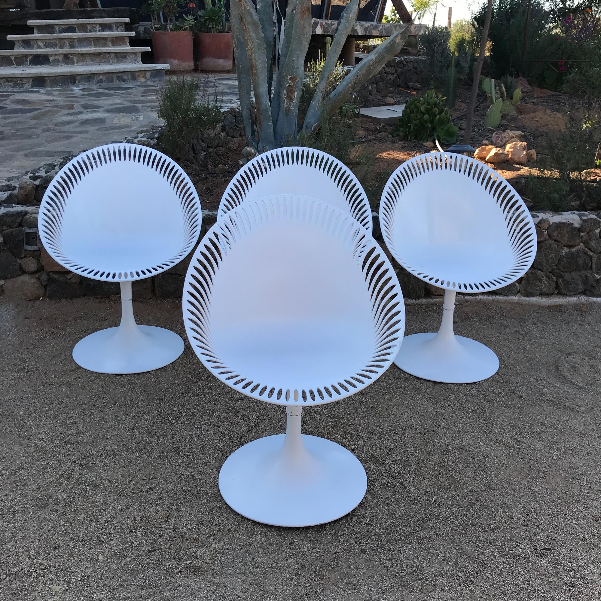Set of Four White Sculptural Fiberglass Chairs with Tulip base. 
Atomic Space Age vibe 1970s
No label present. 
In the style of Knoll Saarinen and Philippe Starck for Kartell.
27 W x 24 D x 36 H  Seat 18.5 H
Original Unrestored Vintage Preowned