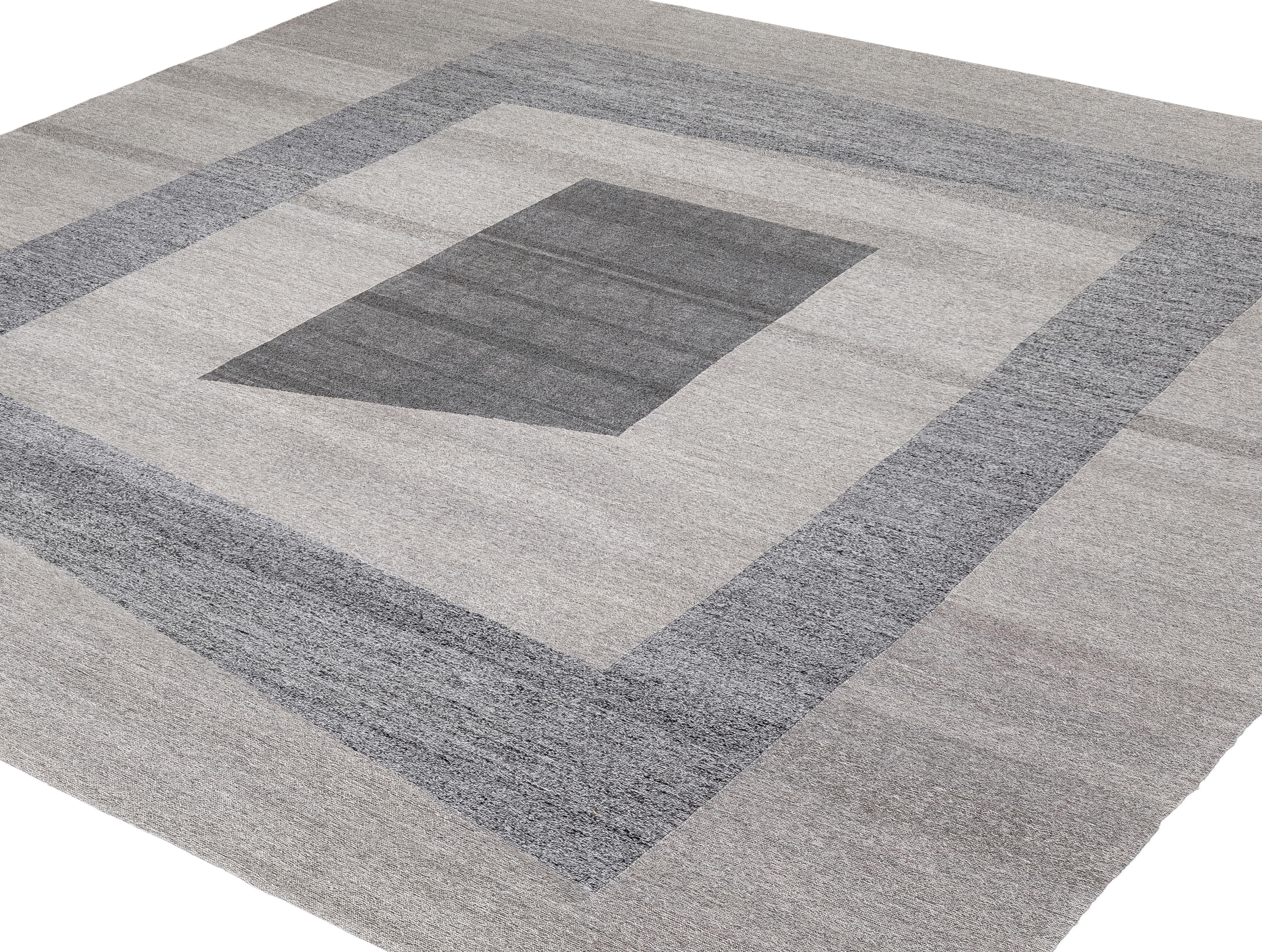 This contemporary Pelas flatweave rug, titled “Sonic,” is handwoven in Iran using handspun wool and 100% natural, organic dyes. Inspired by antique Kurdish kilims, the piece reflects the timeless weaving traditions of the region while showcasing a