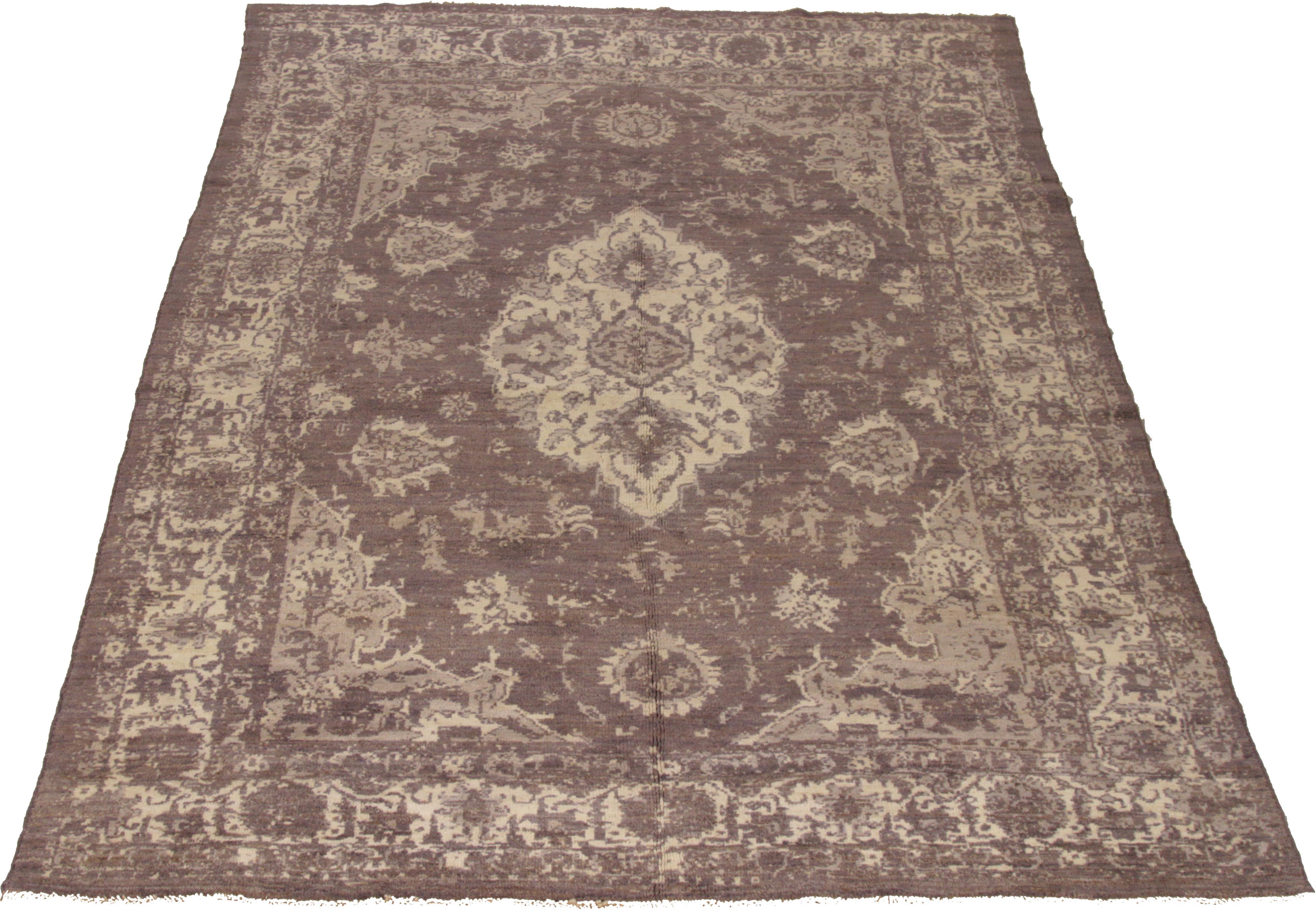 A new production Persian rug handwoven from the finest sheep’s wool and colored with all-natural vegetable dyes that are safe for humans and pets. It’s a traditional Oushak design featuring a brown field with a large floral medallion in ivory. It’s