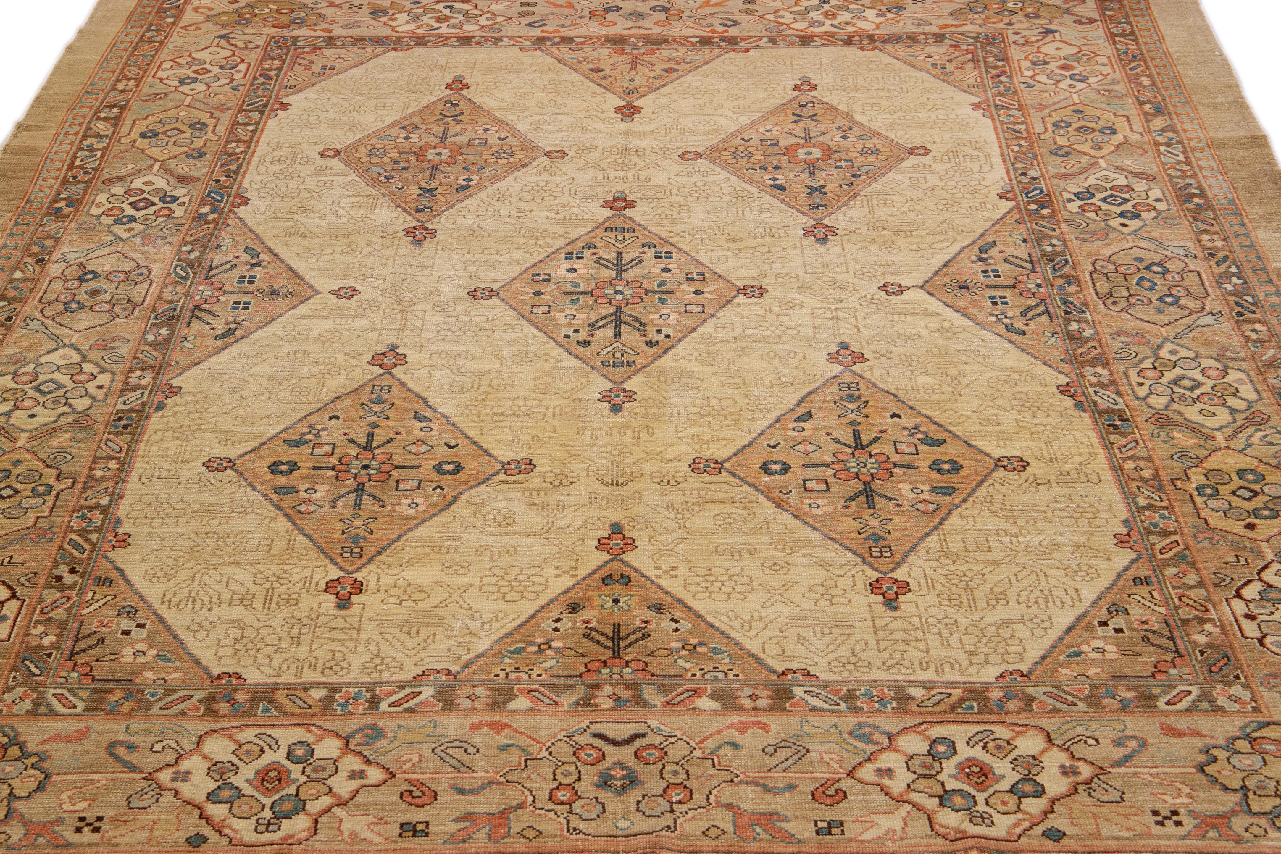 Beautiful modern Persian Serab hand-knotted wool rug with a beige field. This modern rug has gray and tan accents in a gorgeous all-over Classic vine scroll and a palmettes motif.

This rug measures: 8'9