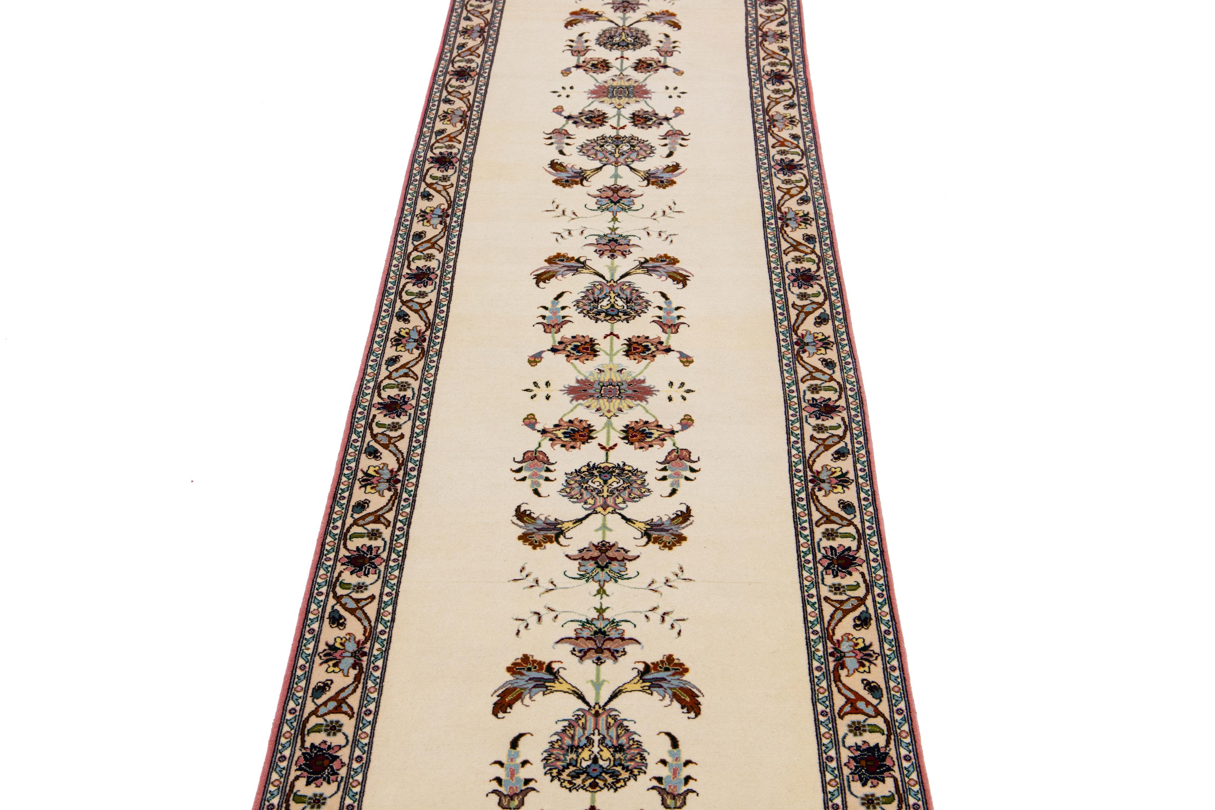 Beautiful Modern Tabriz hand-knotted wool runner with an ivory field. This Tabriz runner has multicolor accents in a gorgeous all-over Shah Abbasi pattern design.

This runner measures: 2'3