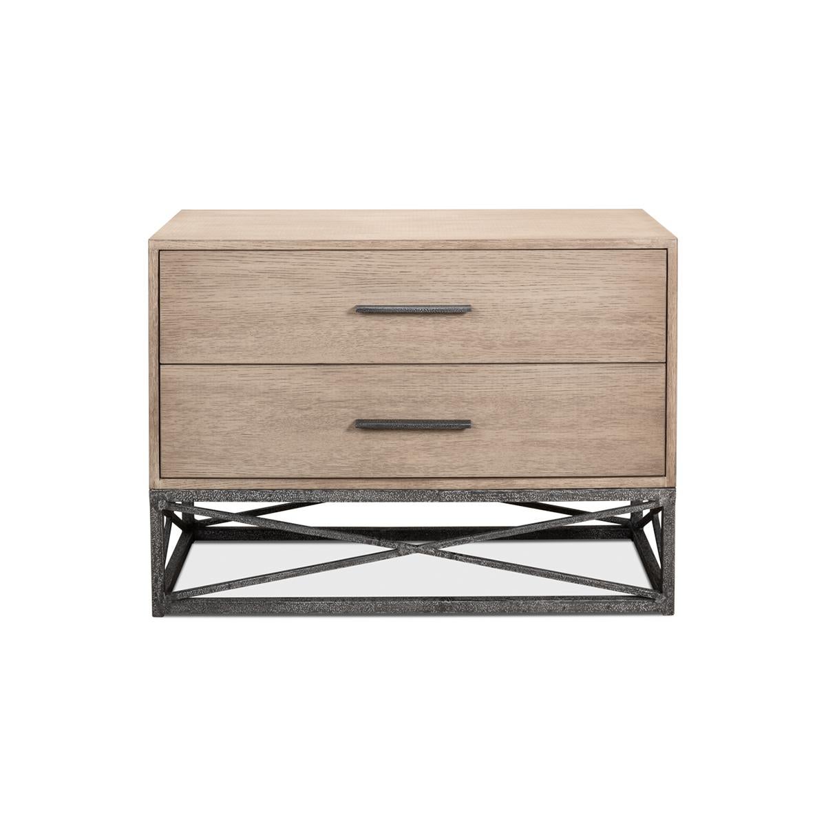 A two-drawer chest with mixed materials and inspired by modern-day architecture. Pine veneered case with hand-forged iron openwork base.

Dimensions: 44
